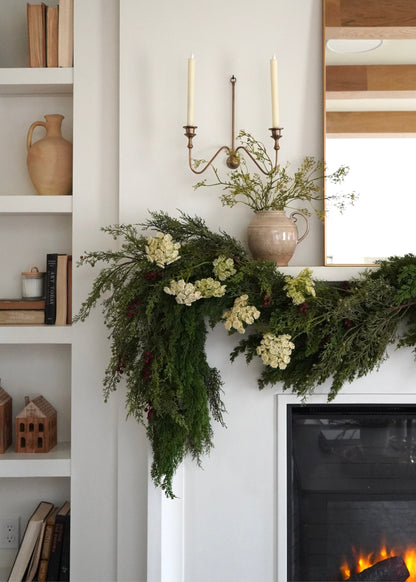 cedar garland on mantel with faux dill and red berry accents