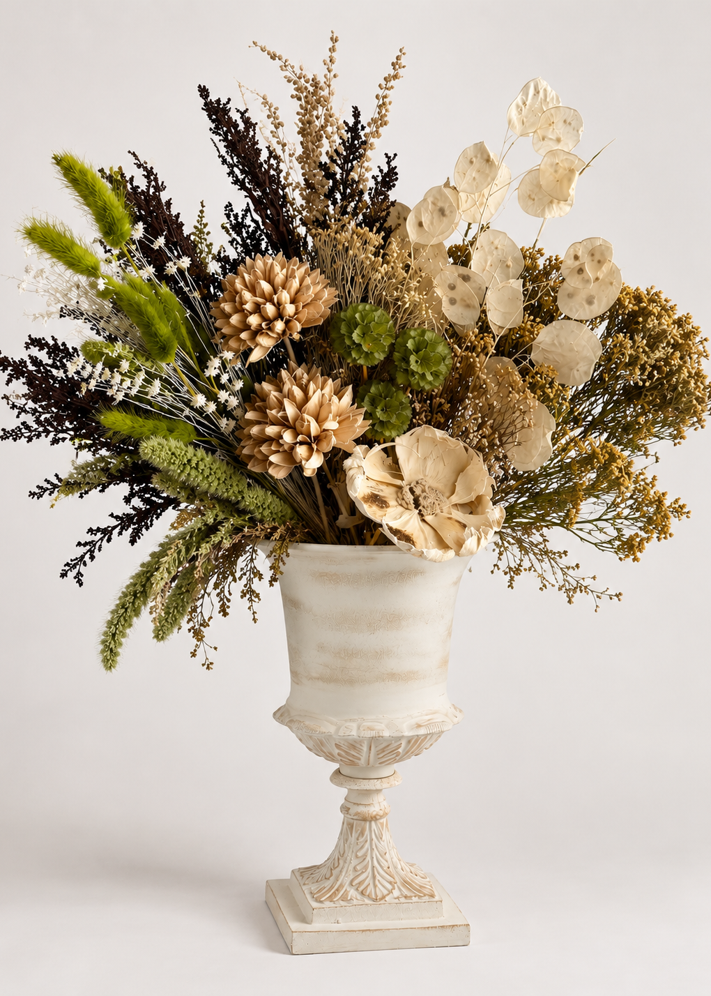 Fall bouquet dried in white urn