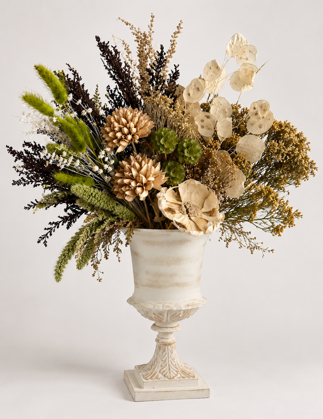 Fall bouquet dried in white urn