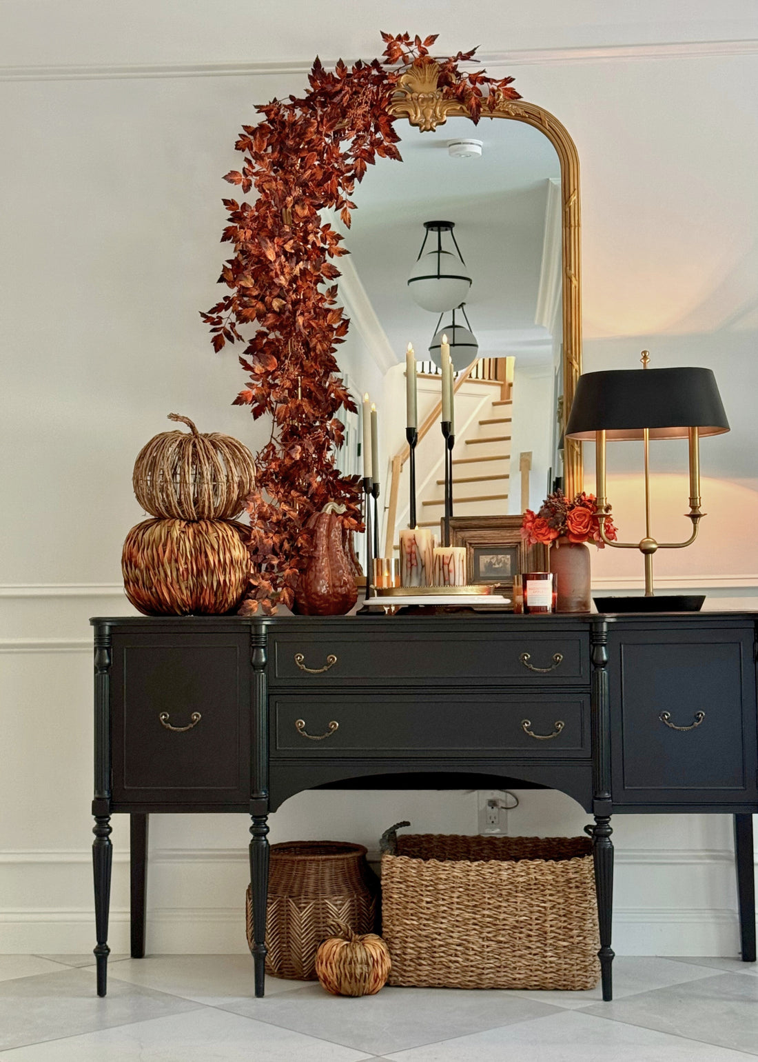 Mirror styled with brown cimicifuga garland for fall