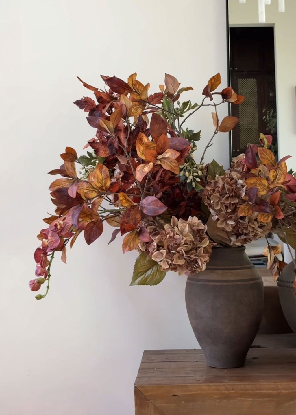fall orchid and leaf arrangement