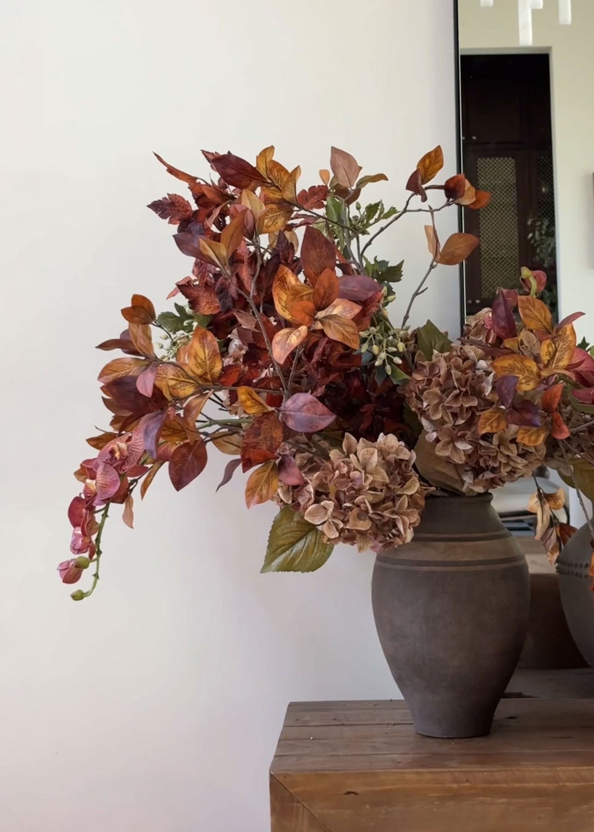 fall orchid and leaf arrangement