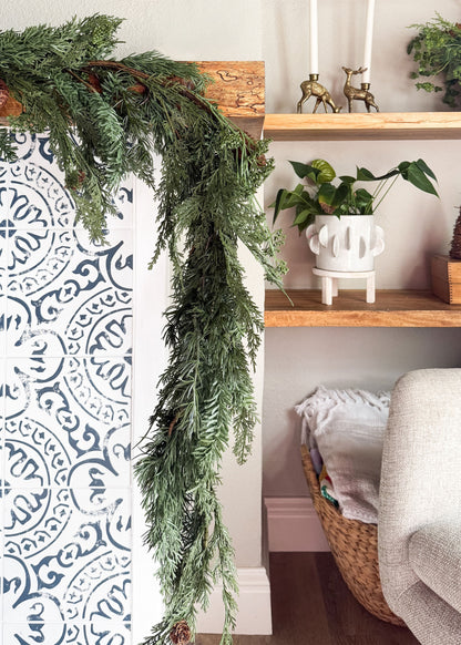 spruce and pine garland on mantel