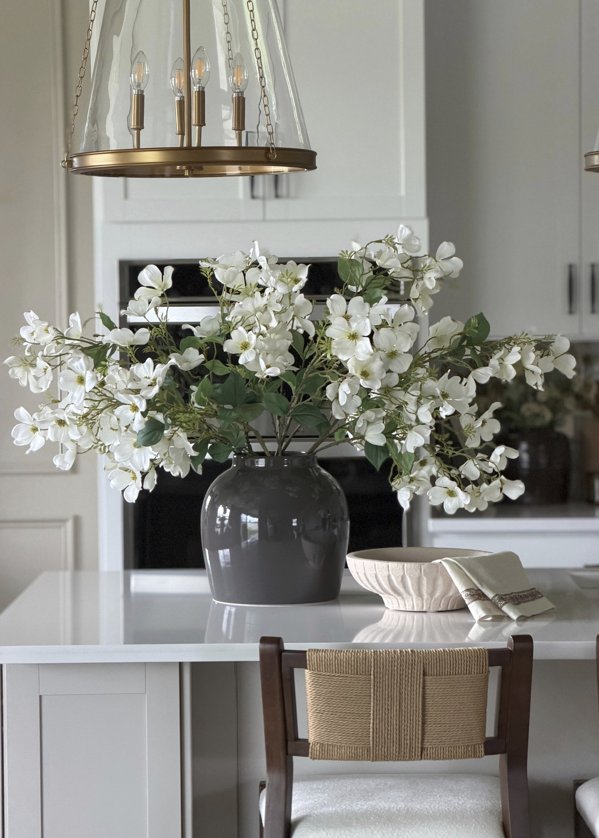 Faux white doggwod arrangement in slate colored vase