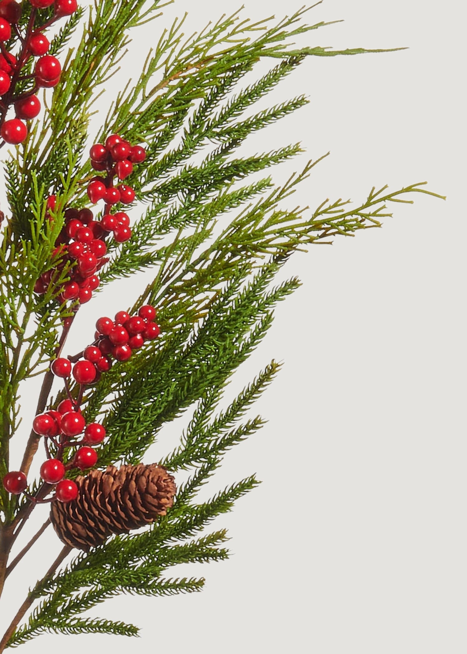 Close-up of Artificial Winter Pine with Red Berries Branch