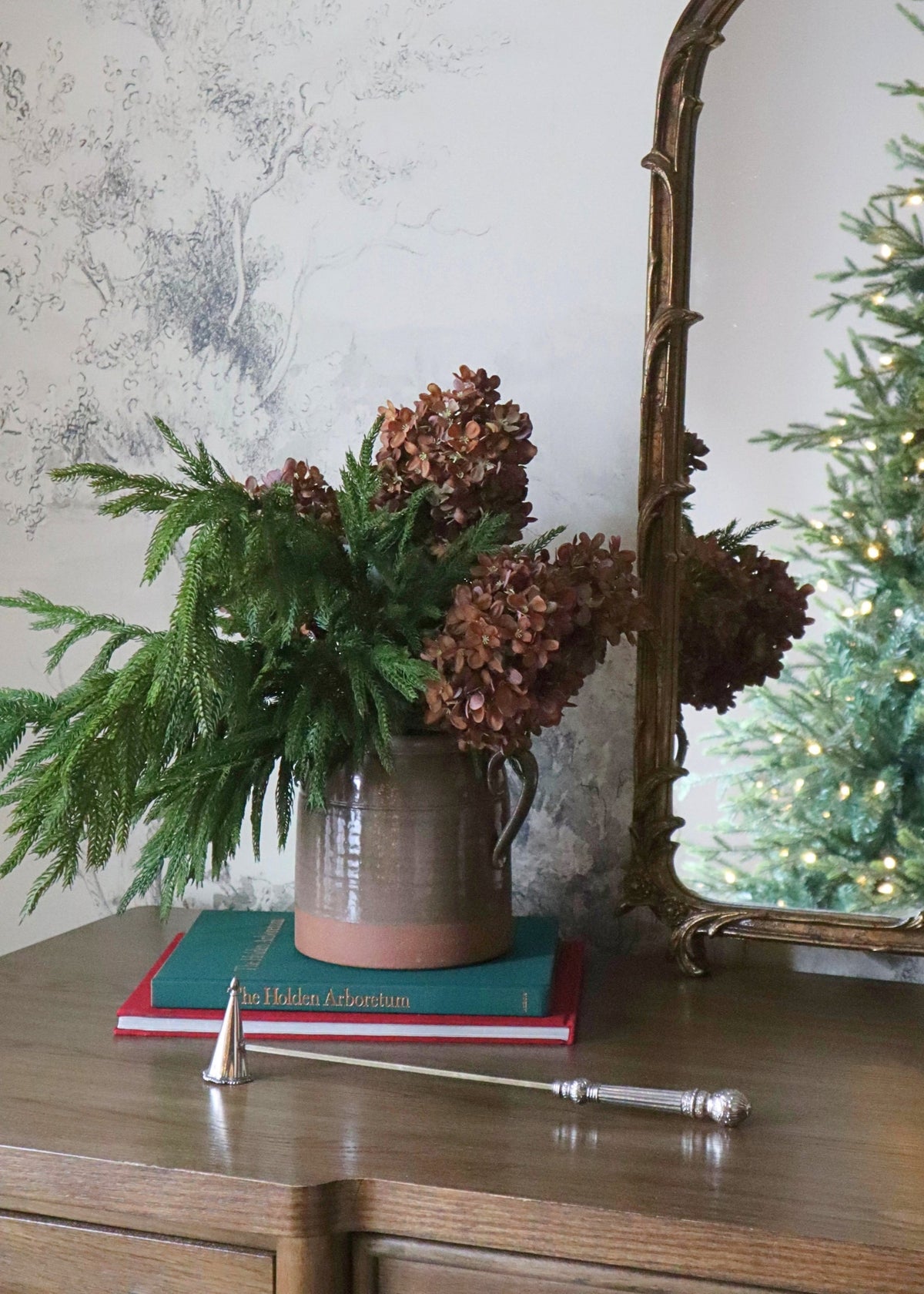 Norfolk pine and hydrangeas styled in a crock