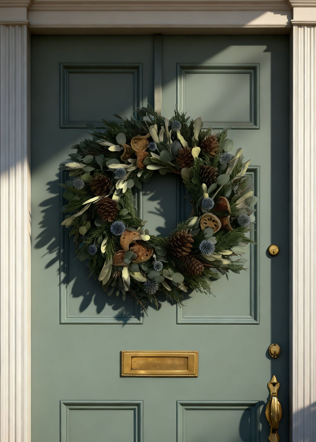 Front Door with Winter Greenery Wreath with Quince and Cones