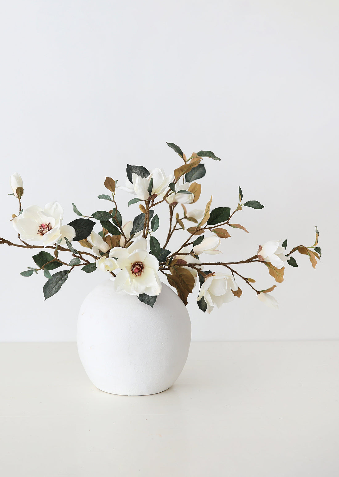 Styled Artificial Luxe Magnolia Flower Branches in Vase