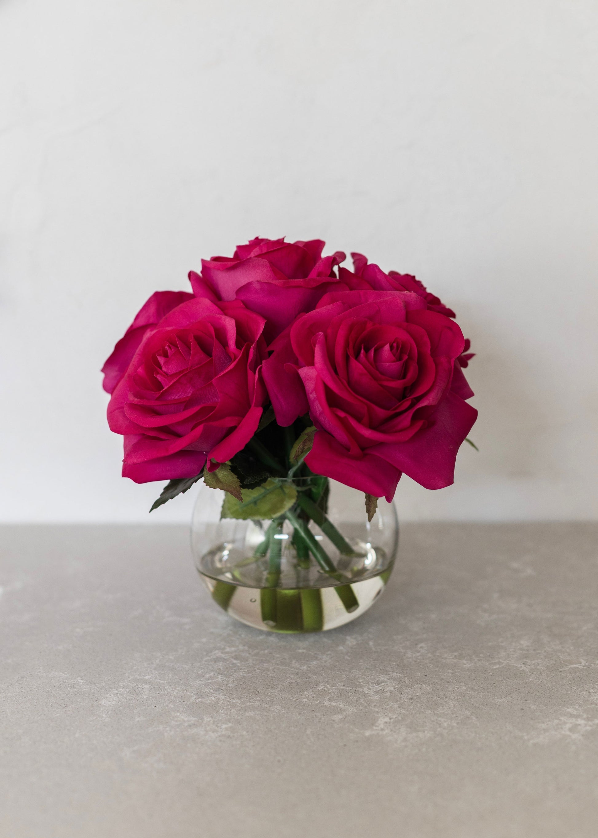 pink roses in a clear vase 