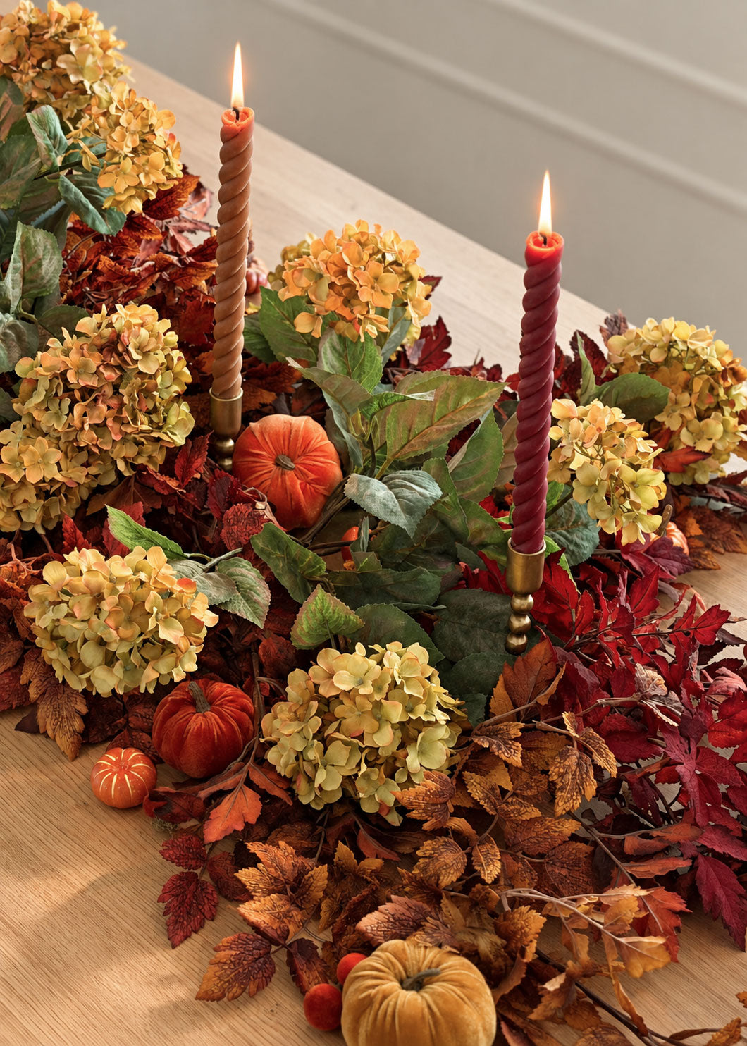 wax tapers with cimicifuga leaves and hydrangeas