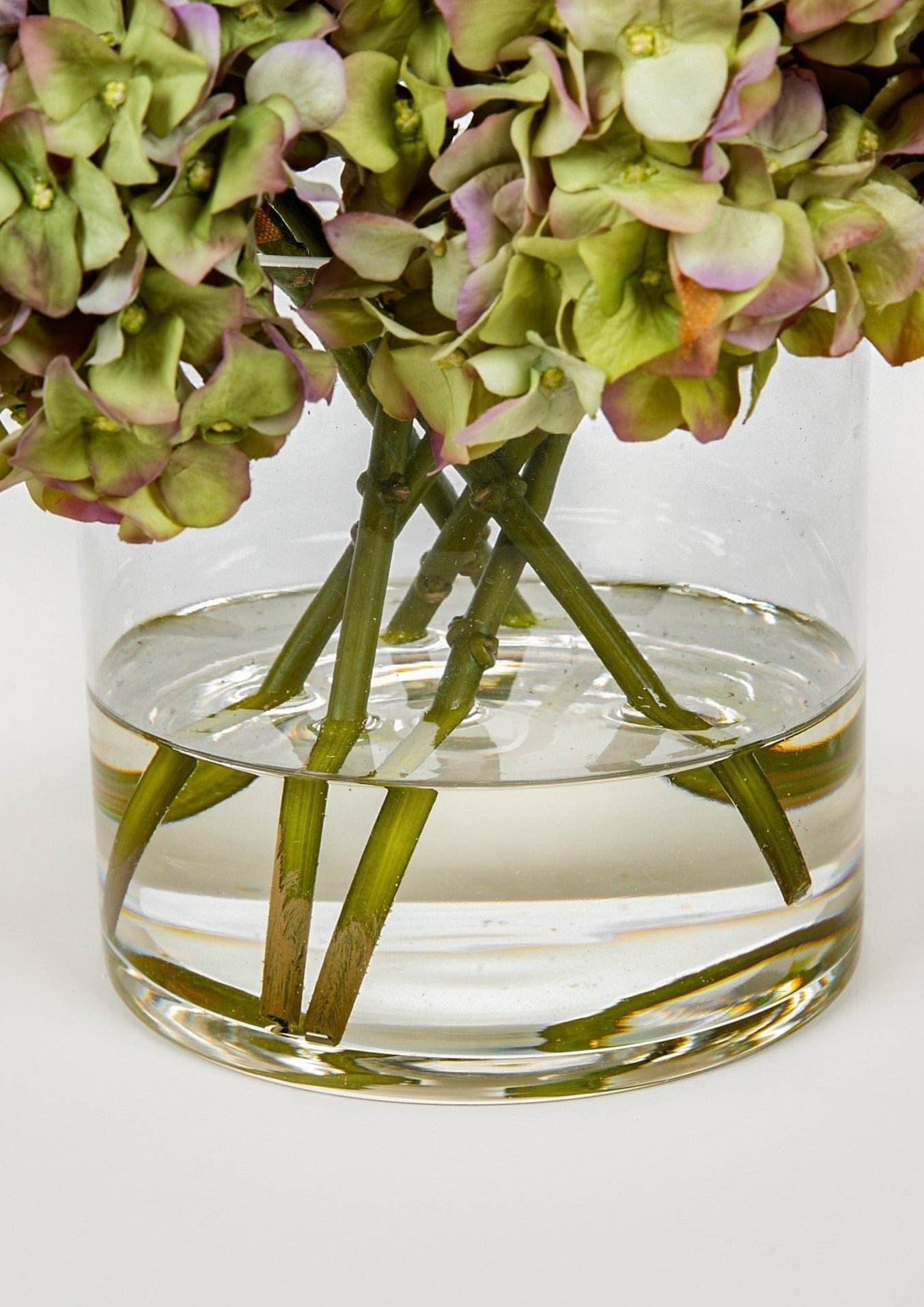 Afloral Closeup of Glass Vase and Acrylic Water in Faux Hydrangea Flower Arrangement