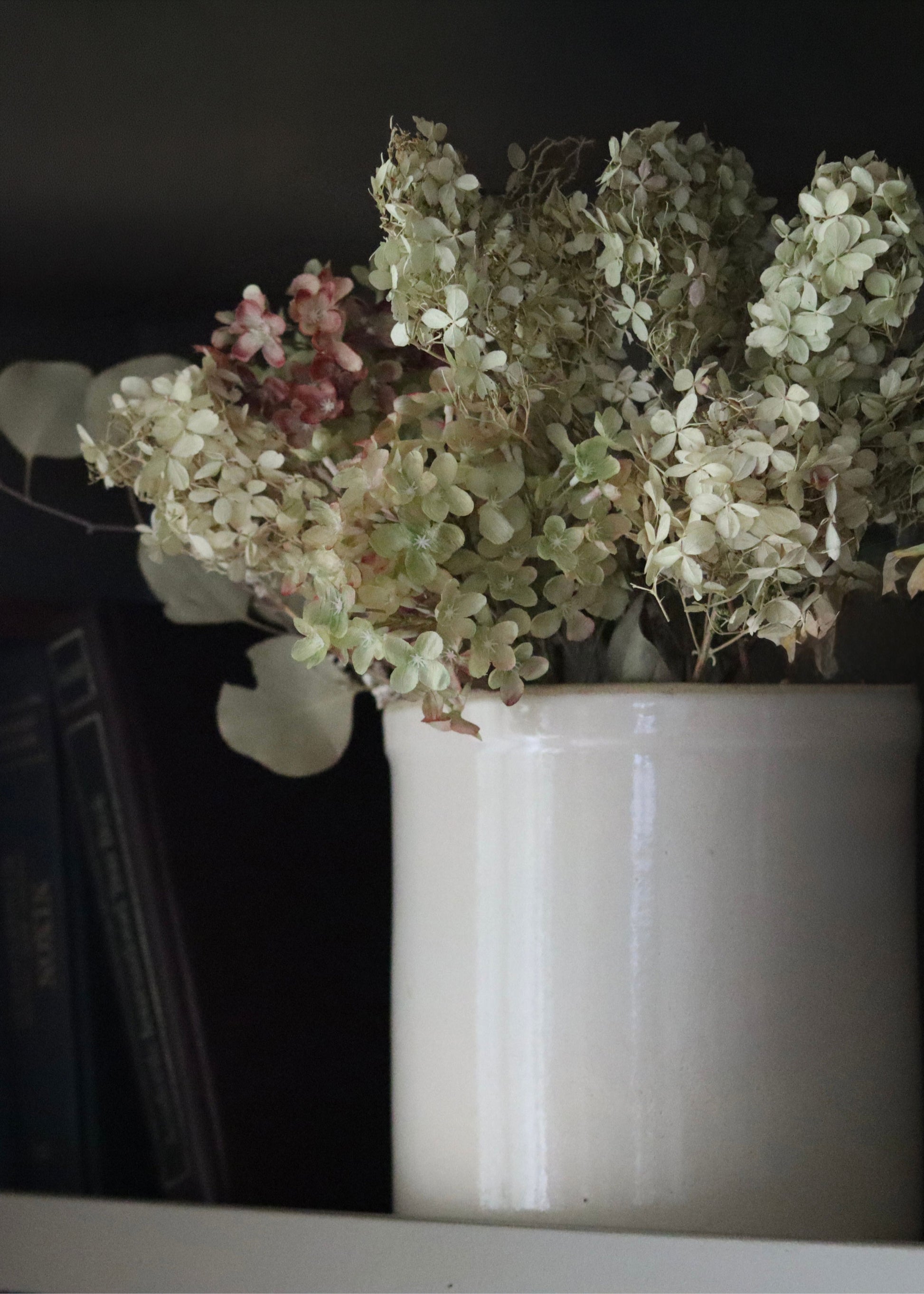 dried hydrangeas styled in a crock