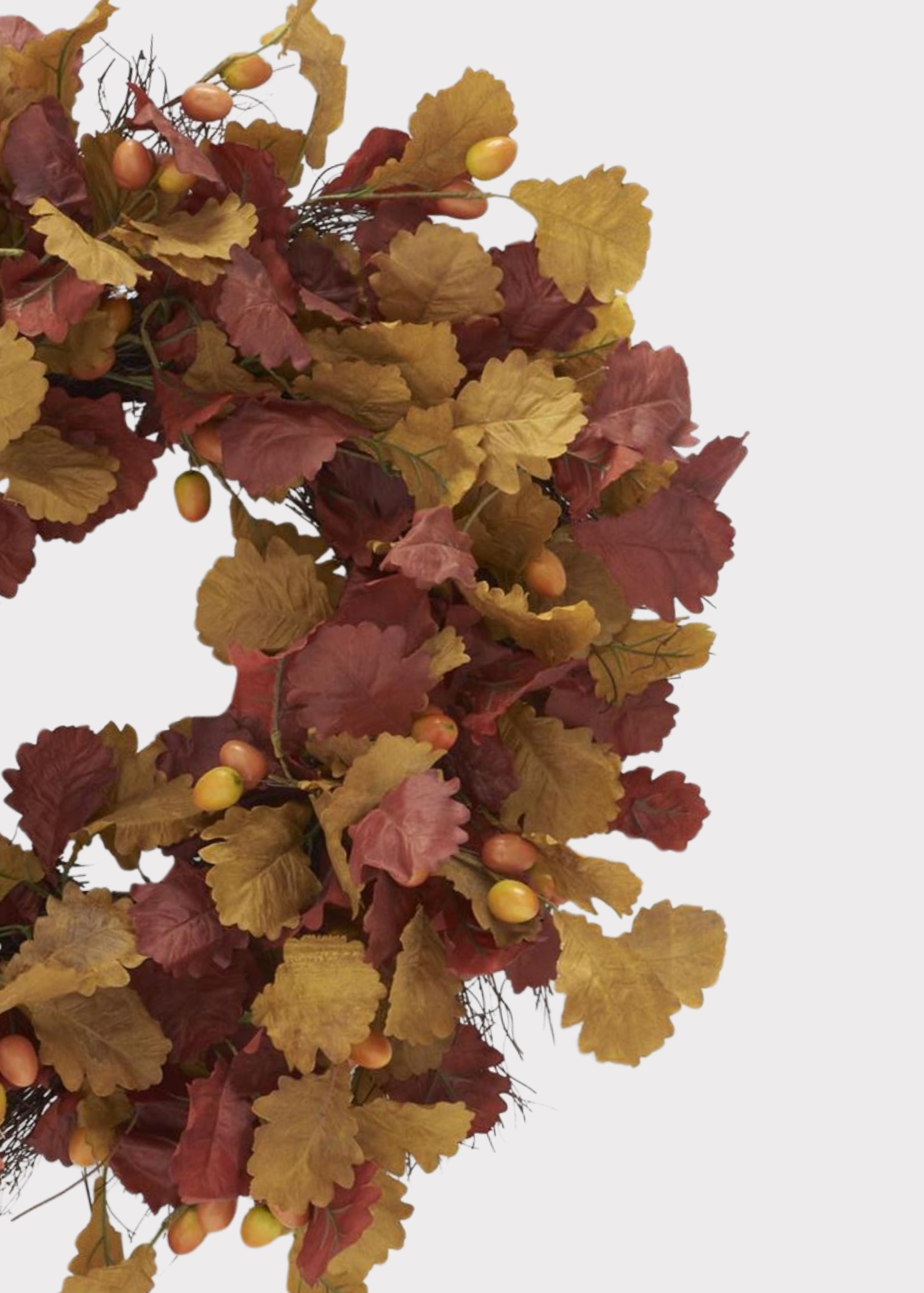 Autumn wreath with faux oak leaves in shades of burgundy, mustard yellow, and tan, accented with small acorns