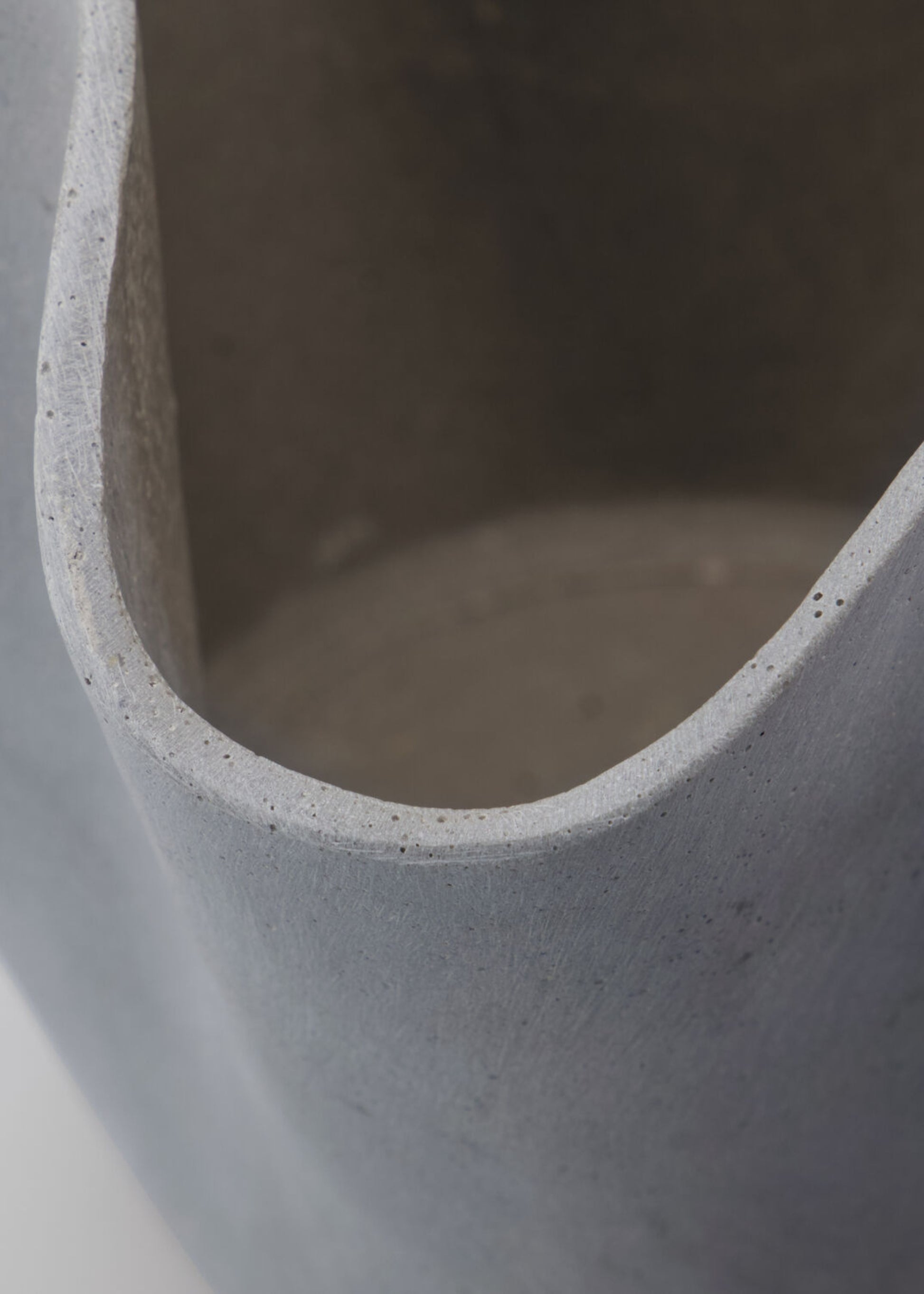 Close-up of a Handmade Polyresin Wavy Planter in Grey