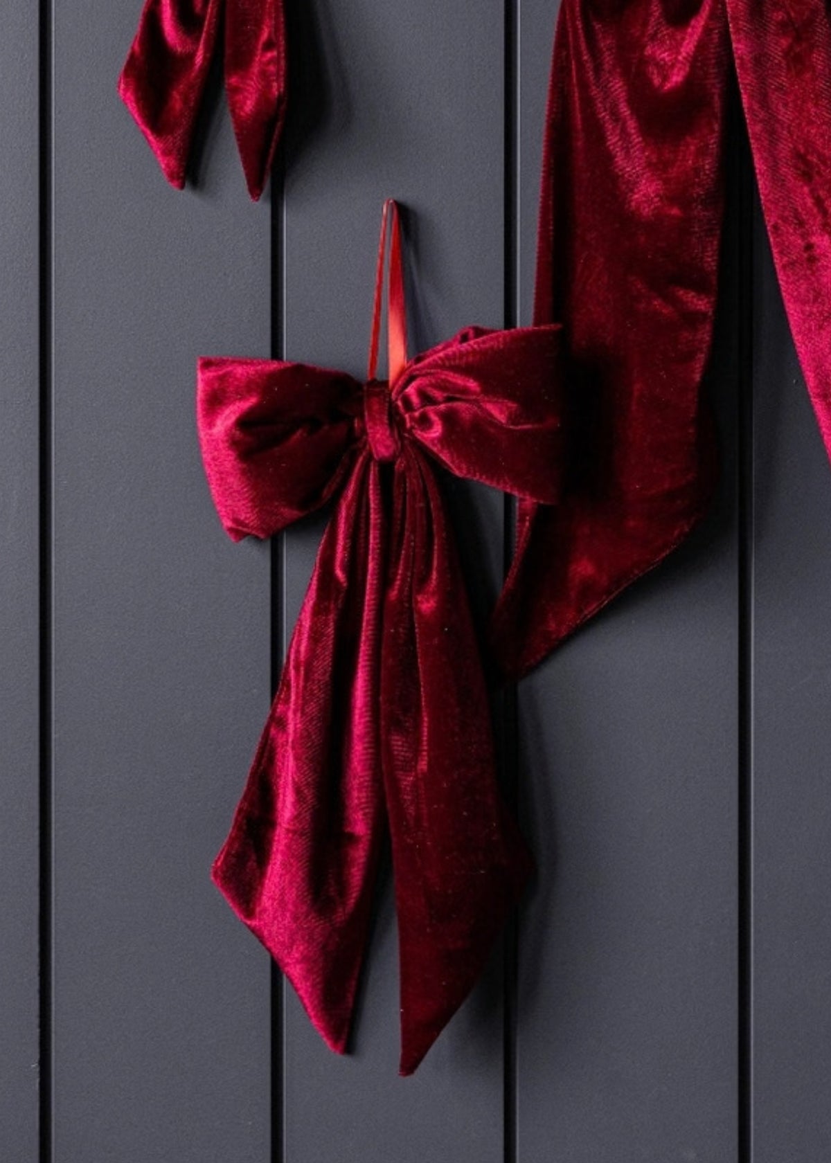 deep red velvet ribbons tied in a bow
