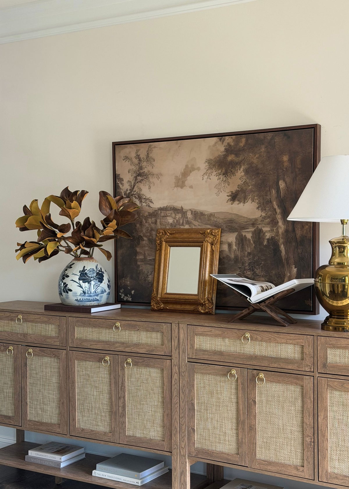 a styled credenza featuring a luxe faux magnolia arrangement