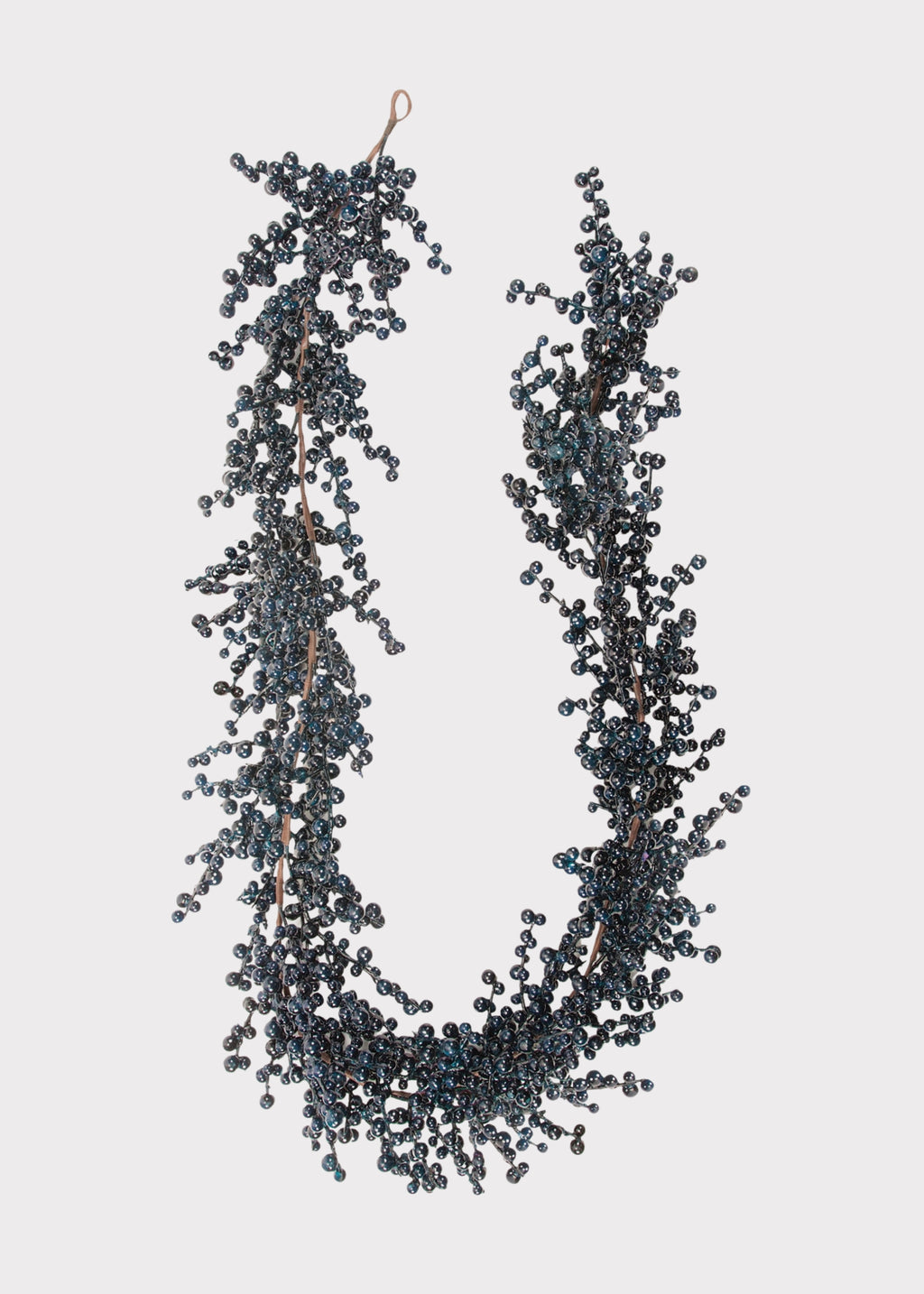 A hanging garland made of dark blue-gray berries on thin brown stem
