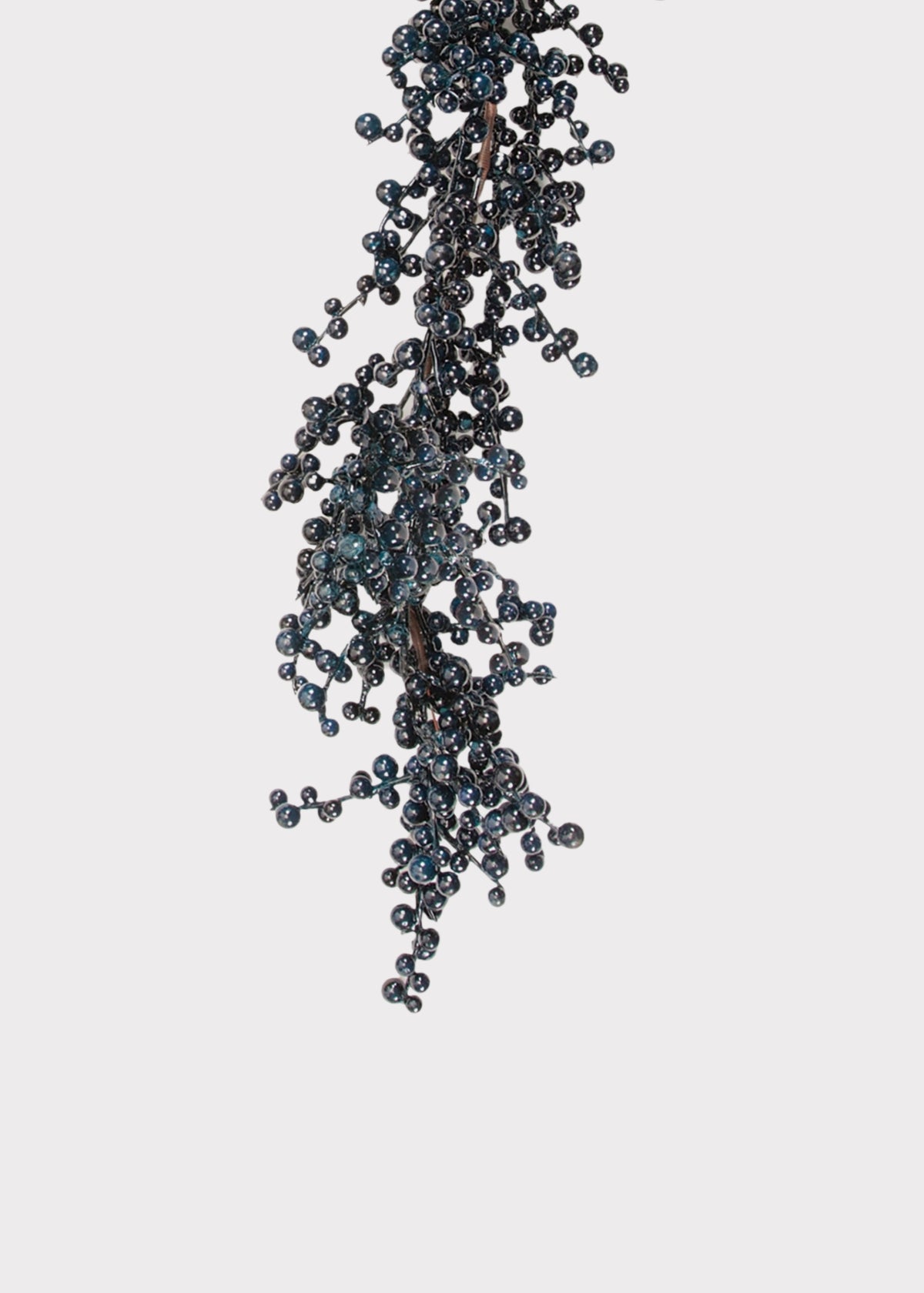 A dark, textured hanging garland  decorative piece covered with many small glossy dark blue to black berries, shown against a plain light gray background.