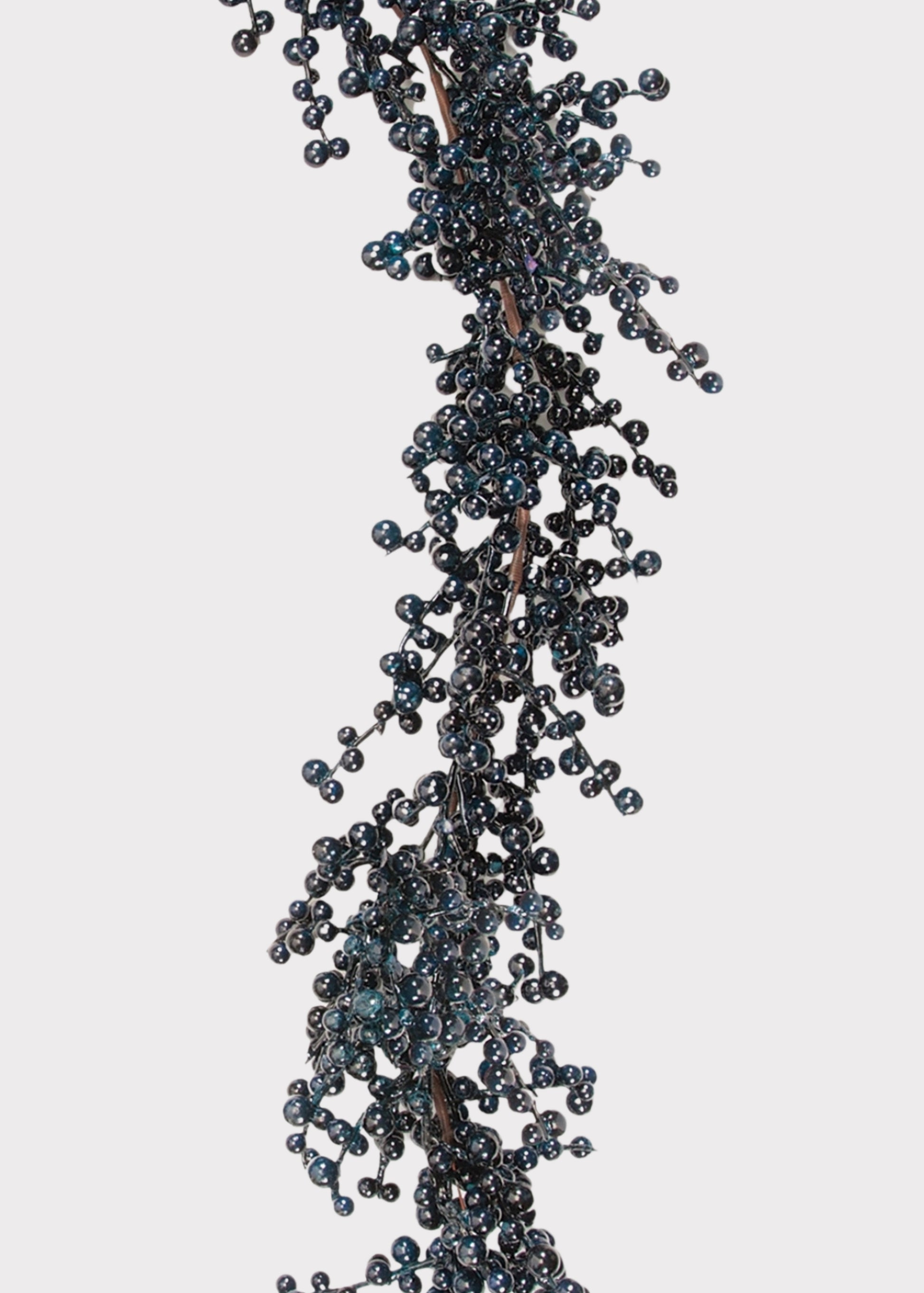 A decorative garland of small, dark blue-gray glossy berries on a brown stem