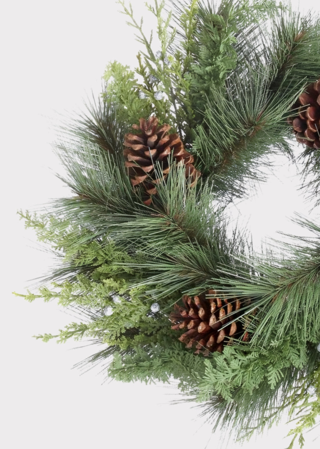 Close-up of Fake Juniper and Pine Cone Winter Wreath