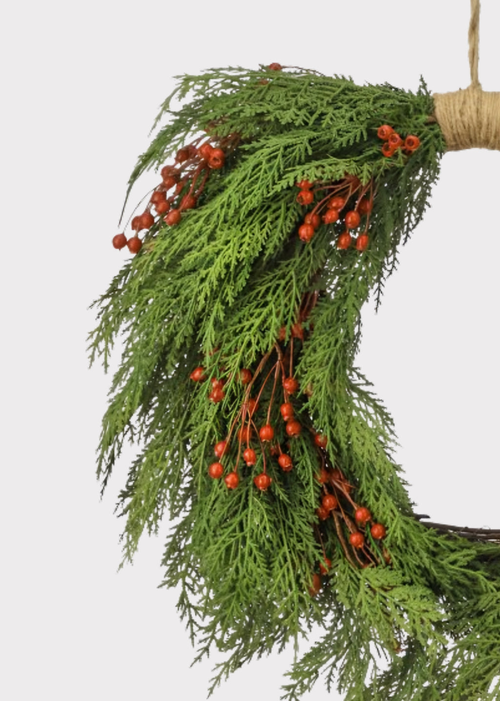 Close-up of a Real Touch Cedar and Red Berry Artificial Holiday Wreath