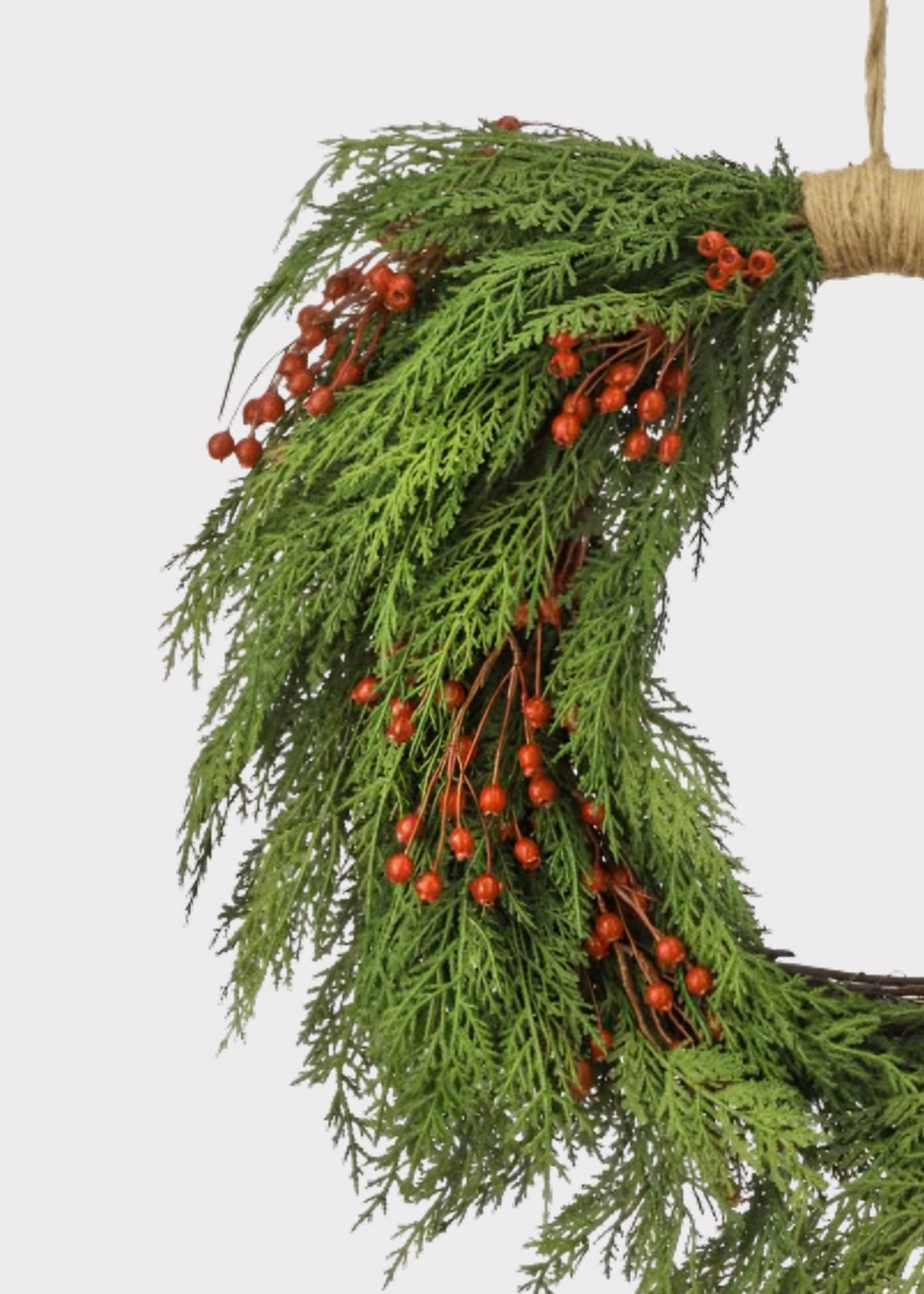 Close-up of a Real Touch Cedar and Red Berry Artificial Holiday Wreath