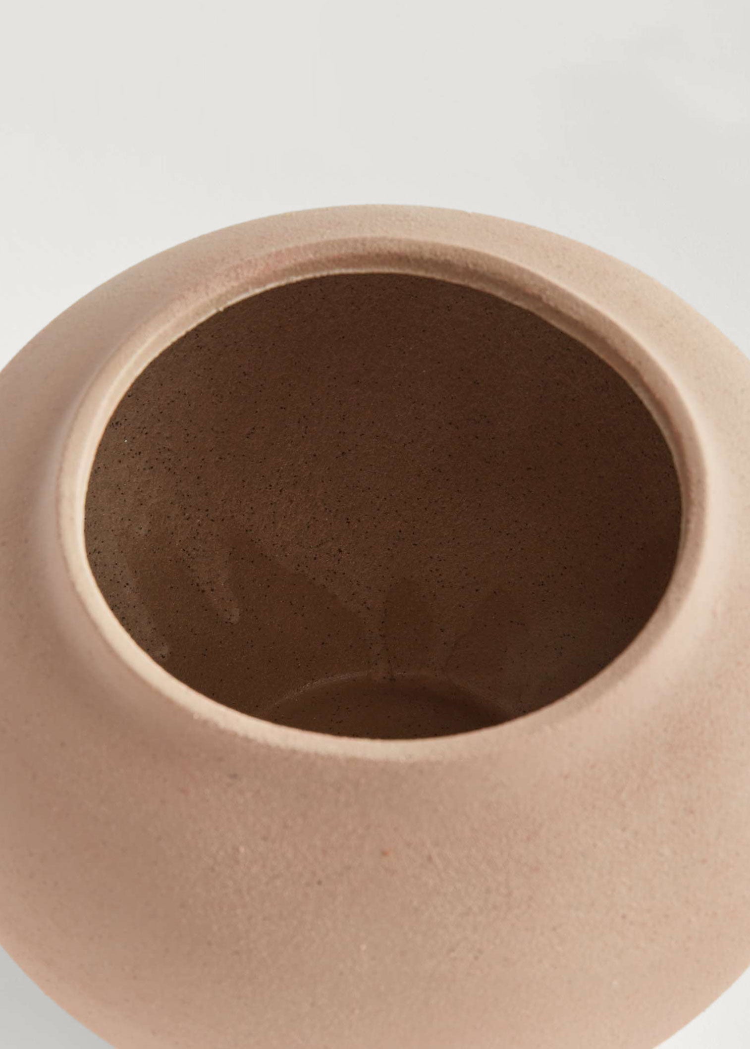 Inside of tan stoneware vase