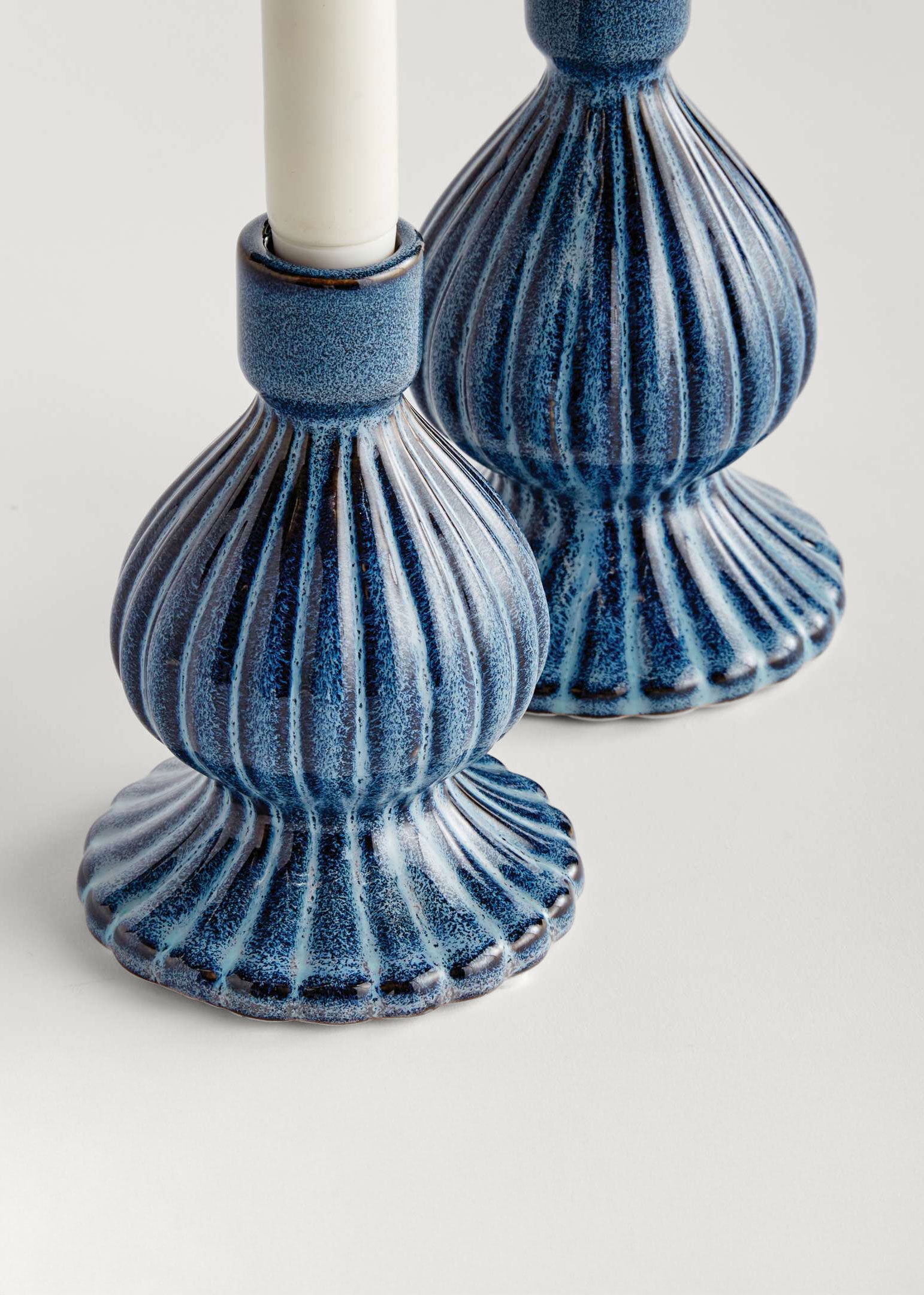 Two blue candle holders 