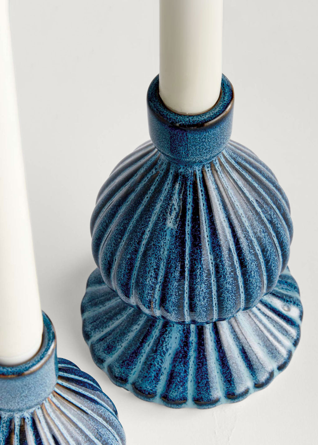 Close-up of Blue Glazed Stoneware Taper Candle Holder