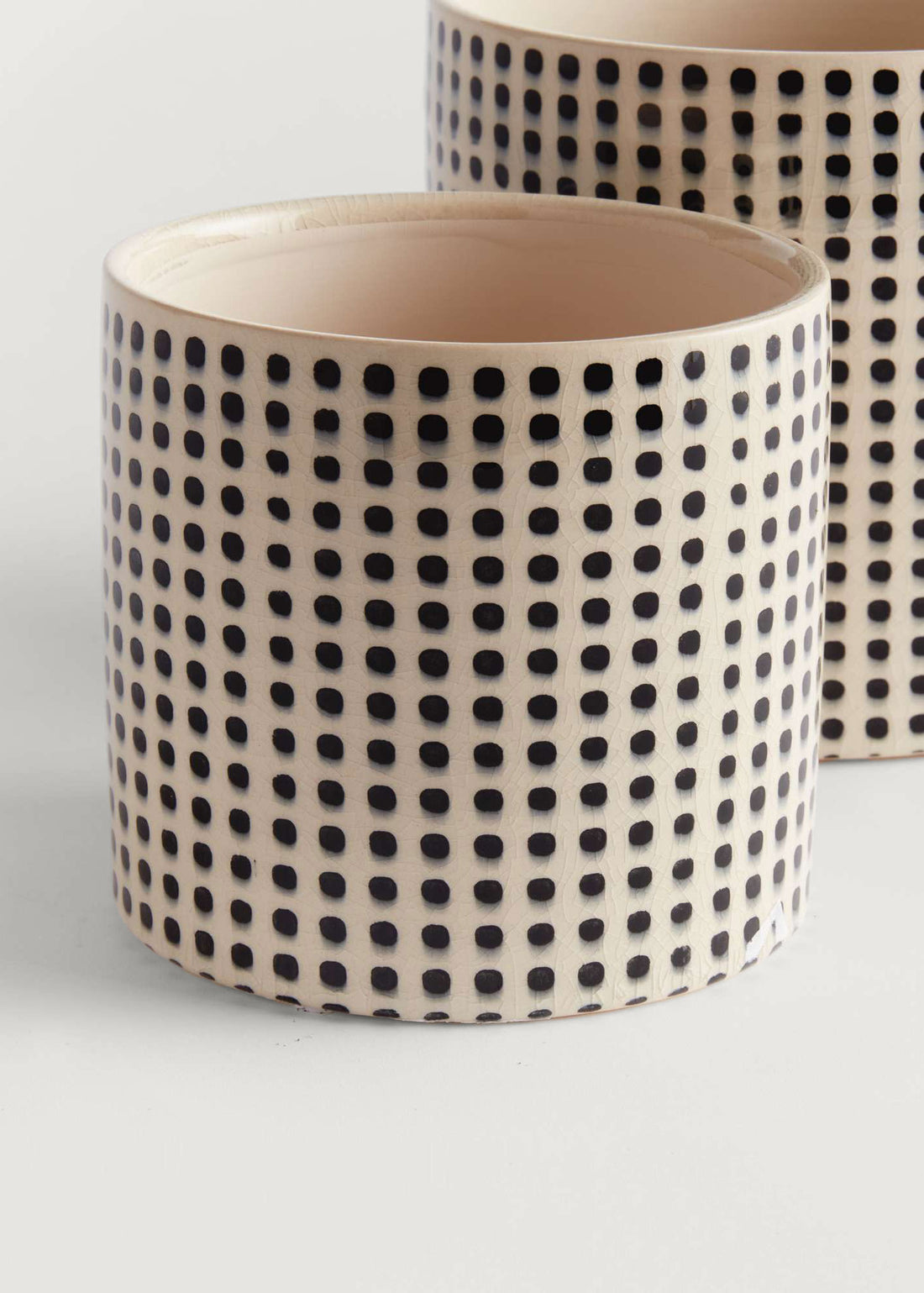 Ceramic pot with black dot pattern