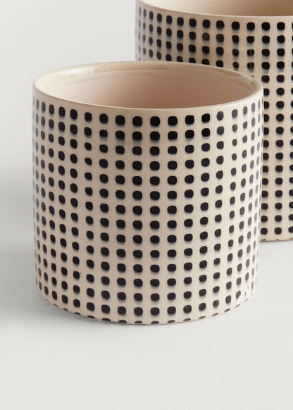 Ceramic pot with black dot pattern