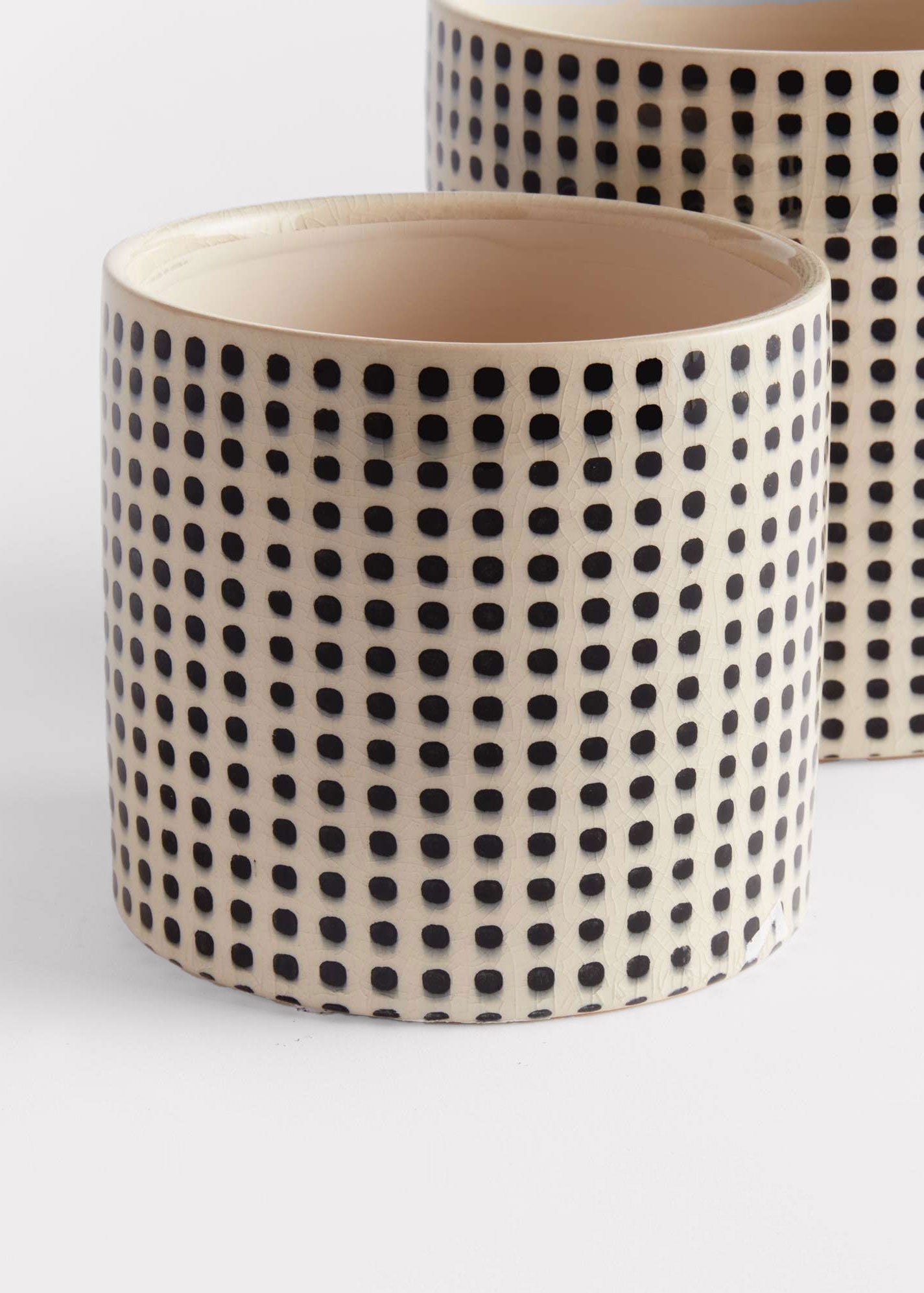 Ceramic pot with black dot pattern
