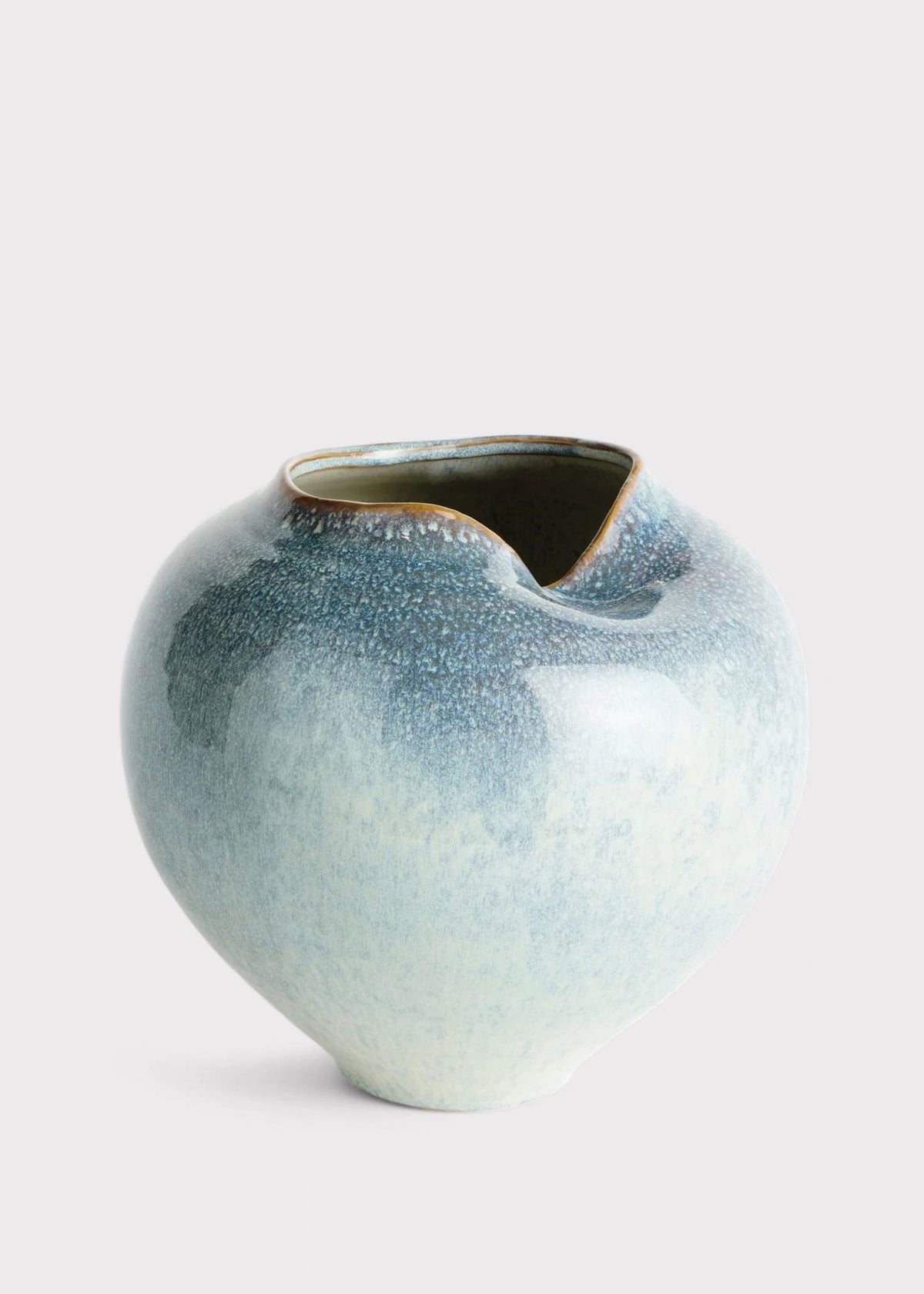 Ceramic vase with a textured blue surface 