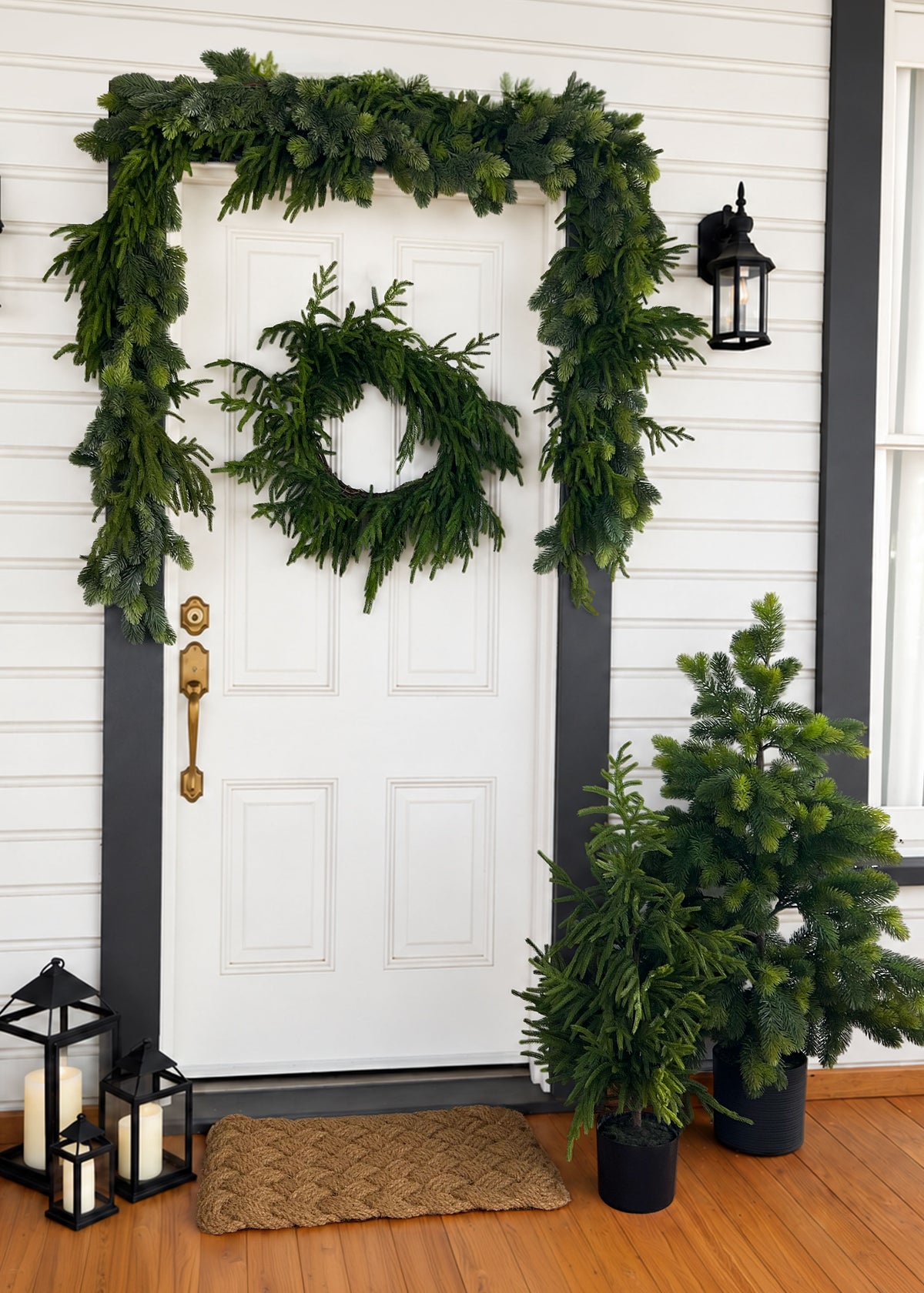 Norfolk and Princess Pine Garlands, Trees and Wreath Styled on a Porch