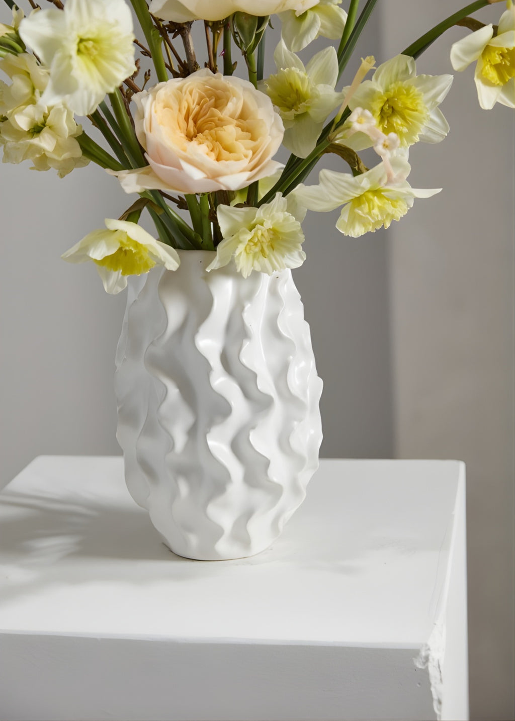 White textured vase with flowers