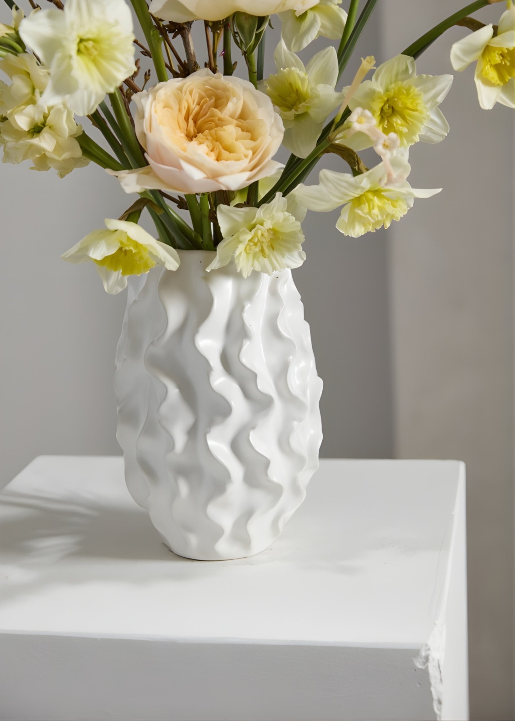 White textured vase with flowers