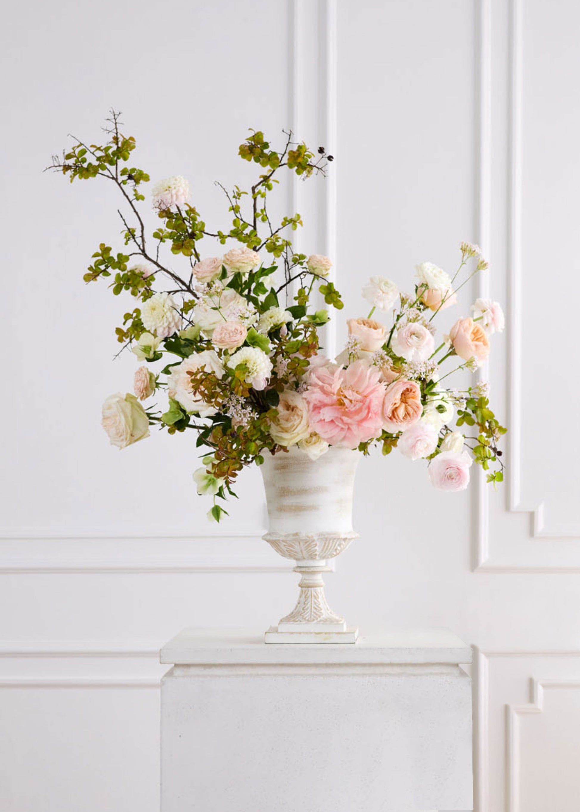 Floral arrangement in a decorative urn vase 