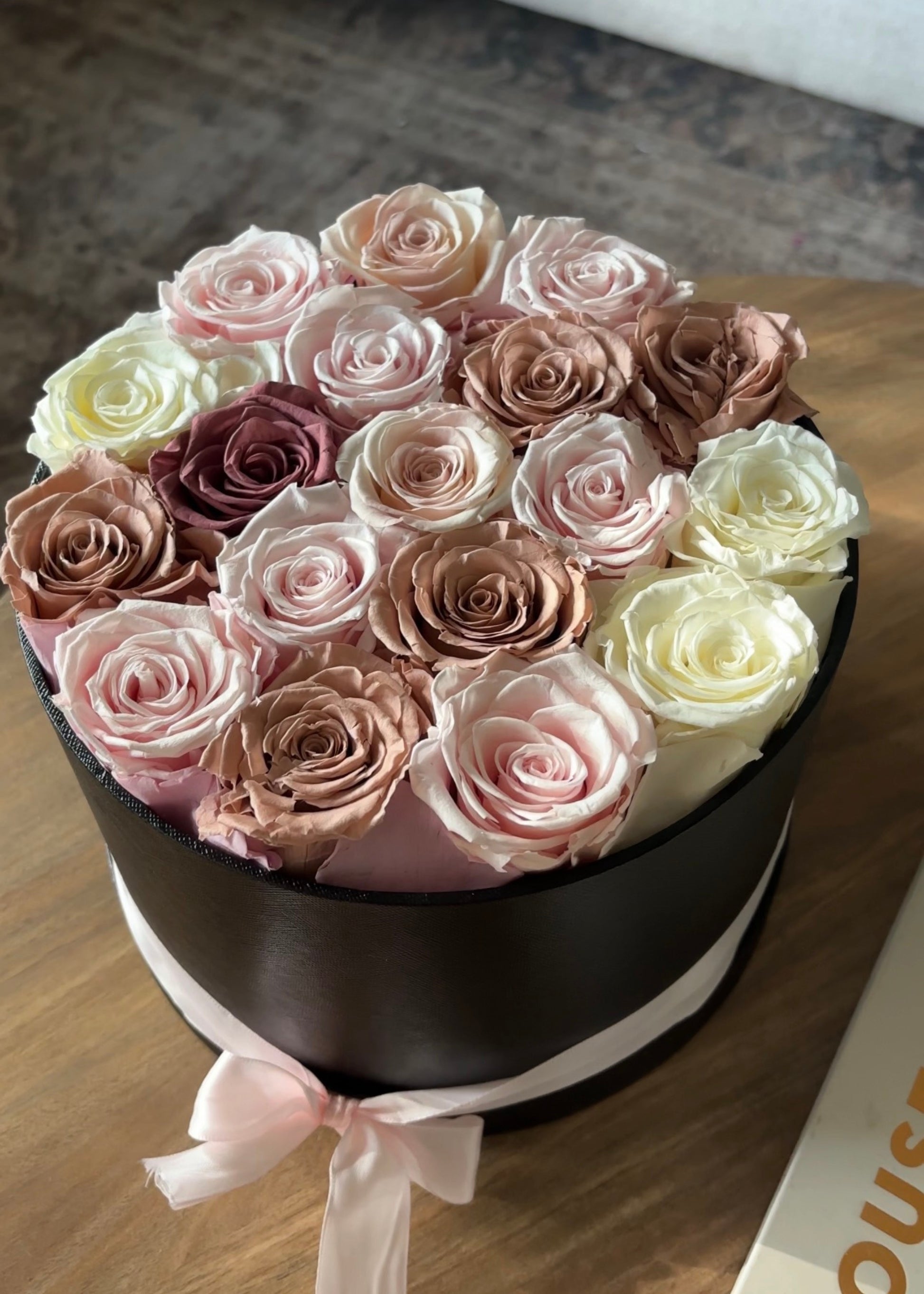 Afloral™ Preserved Rose Head Flower Gift Box on a Coffee Table