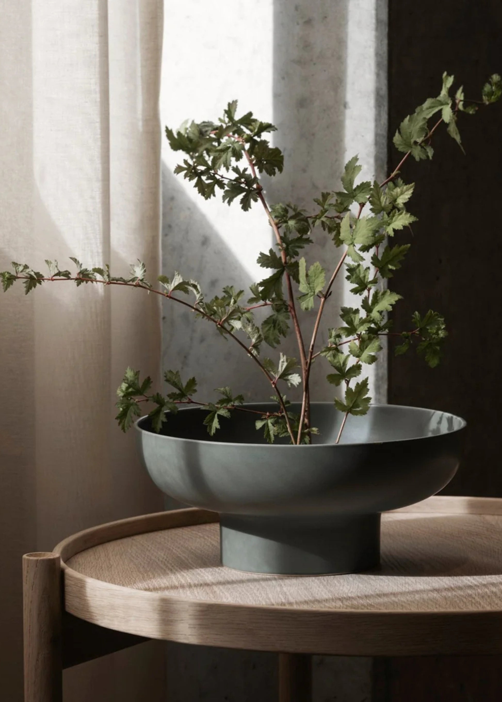 Green Ceramic Footed Vase Styled with Greenery