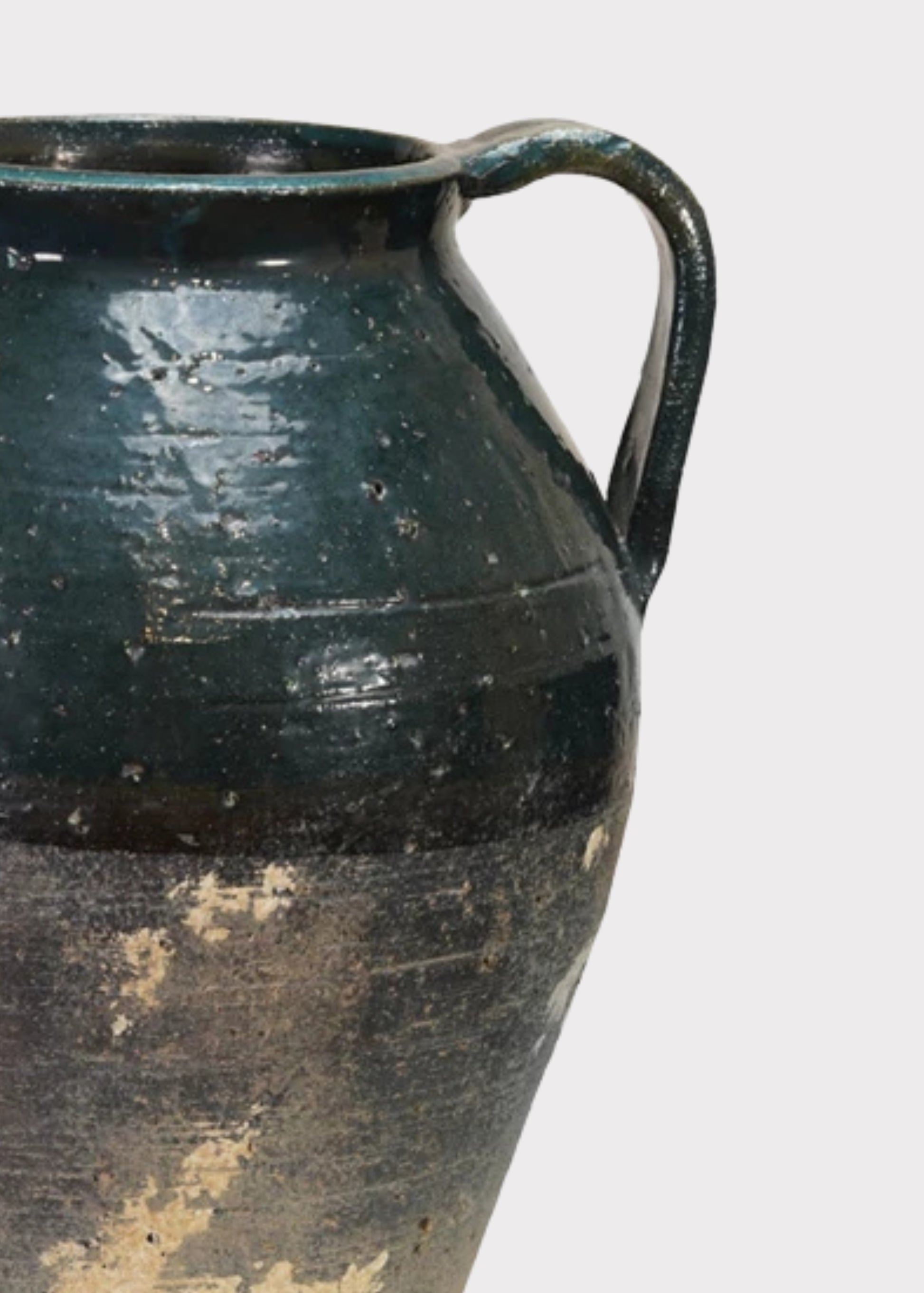 Close-up of Distressed Terra Cotta  Vase with Blue Glaze