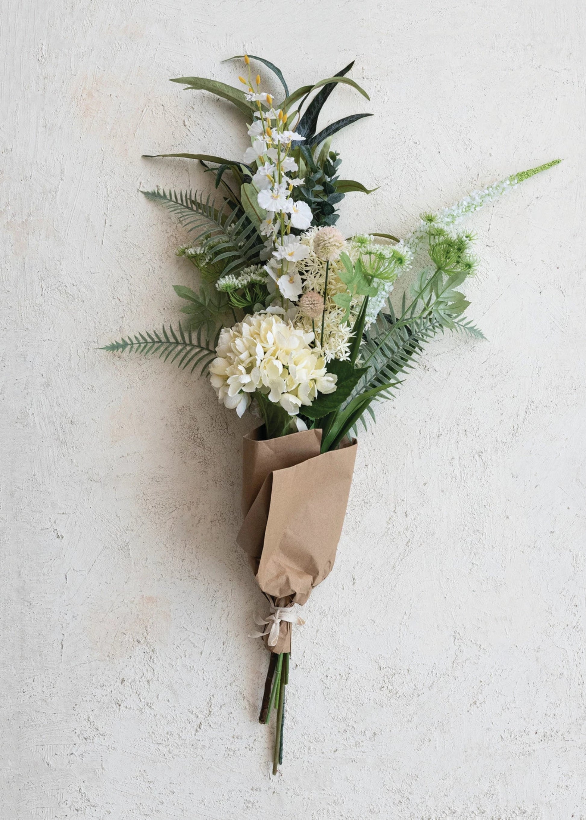Bouquet of flowers wrapped in brown paper