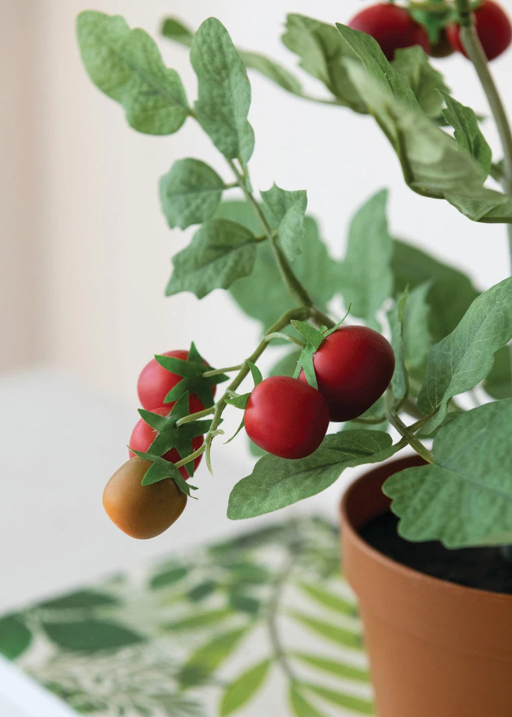 Close-up of artificial potted tomato plant
