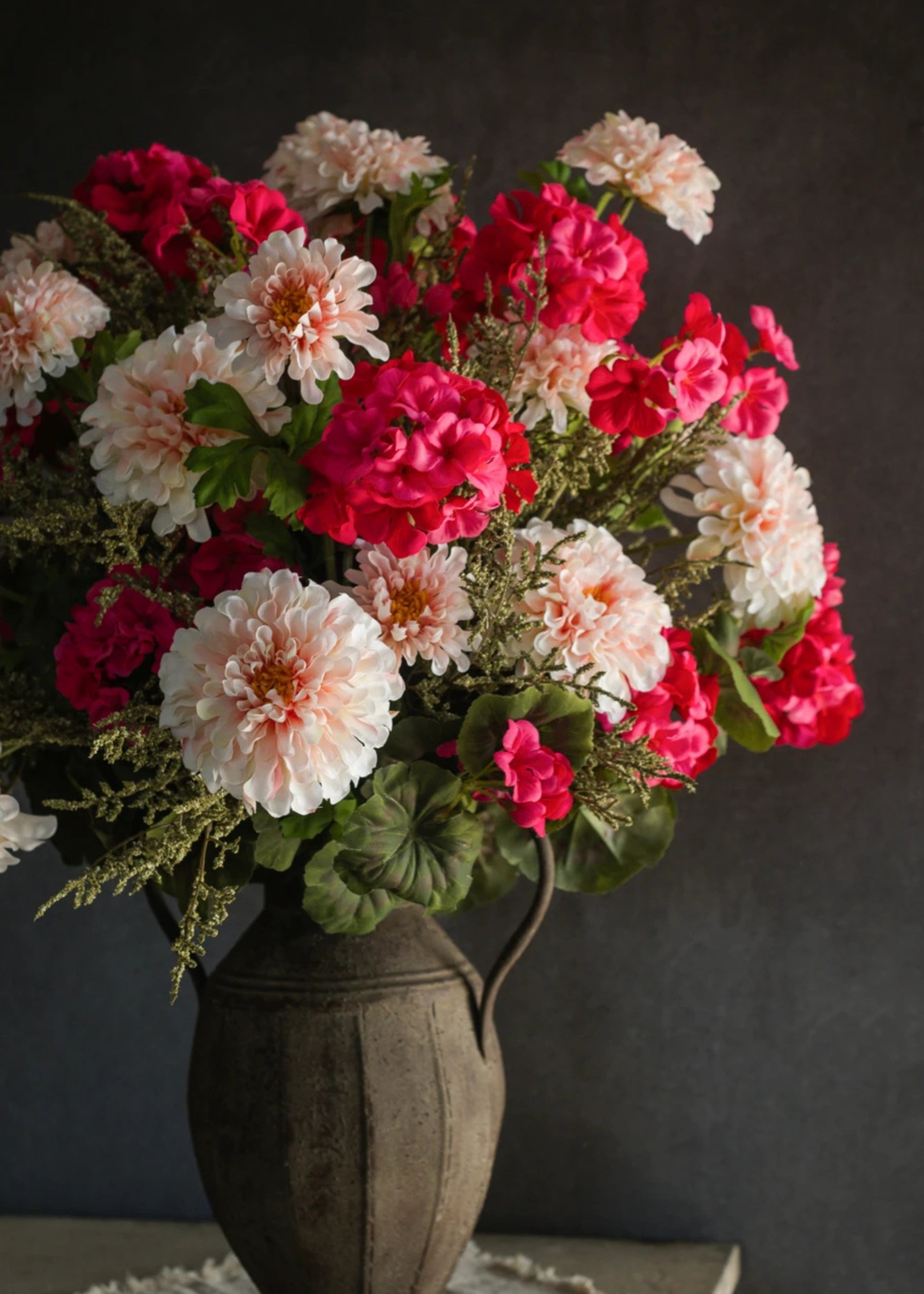 Floral arrangement with faux geraniums