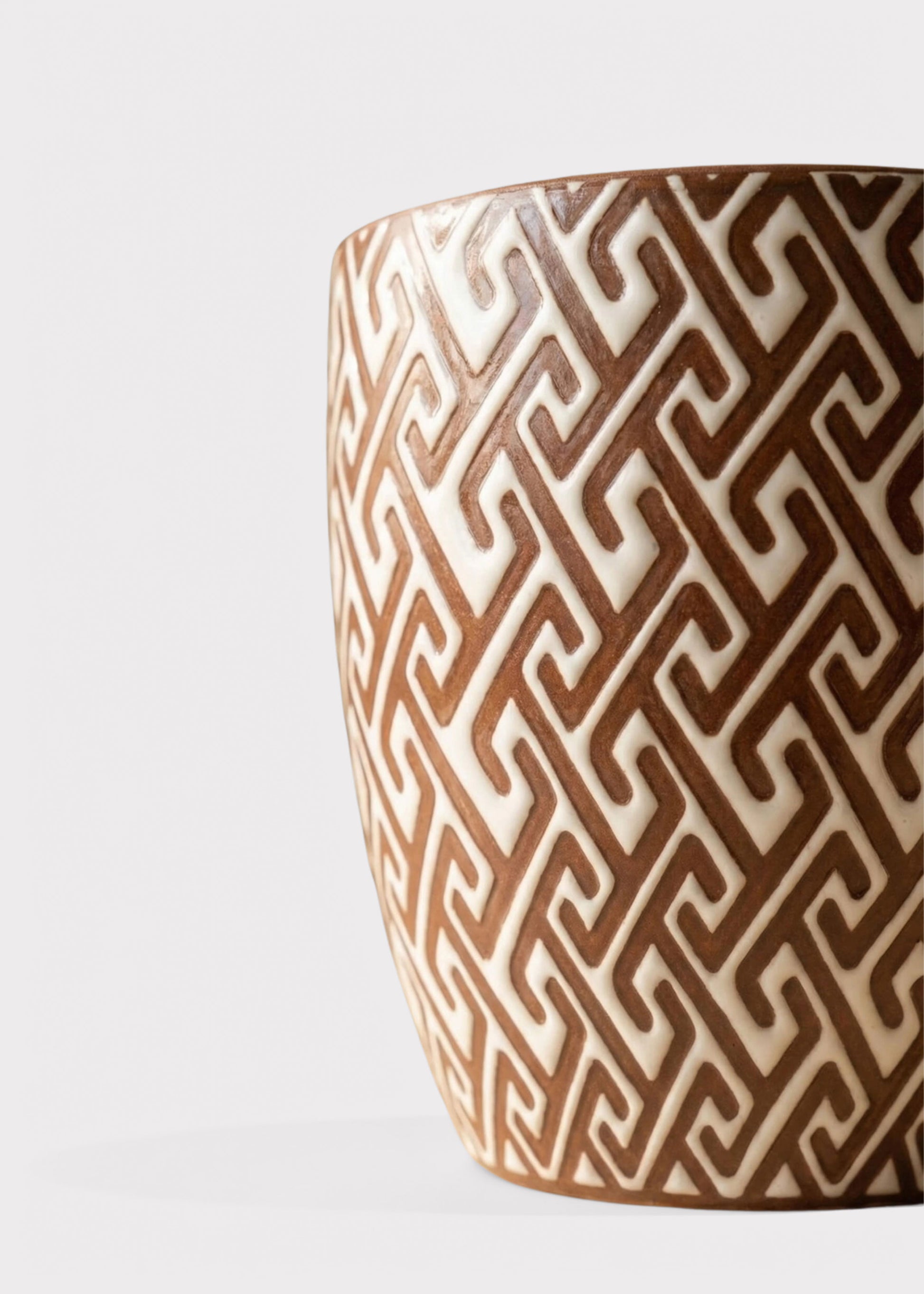 Close-up of a Glossy Ceramic Planter Pot in Brown and White