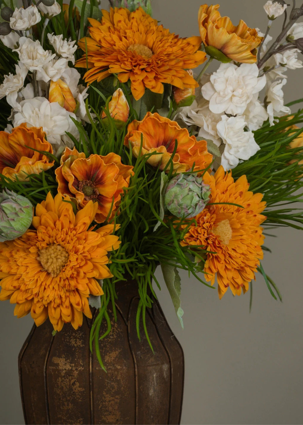 Bouquet of orange and white flowers with faux sunflowers