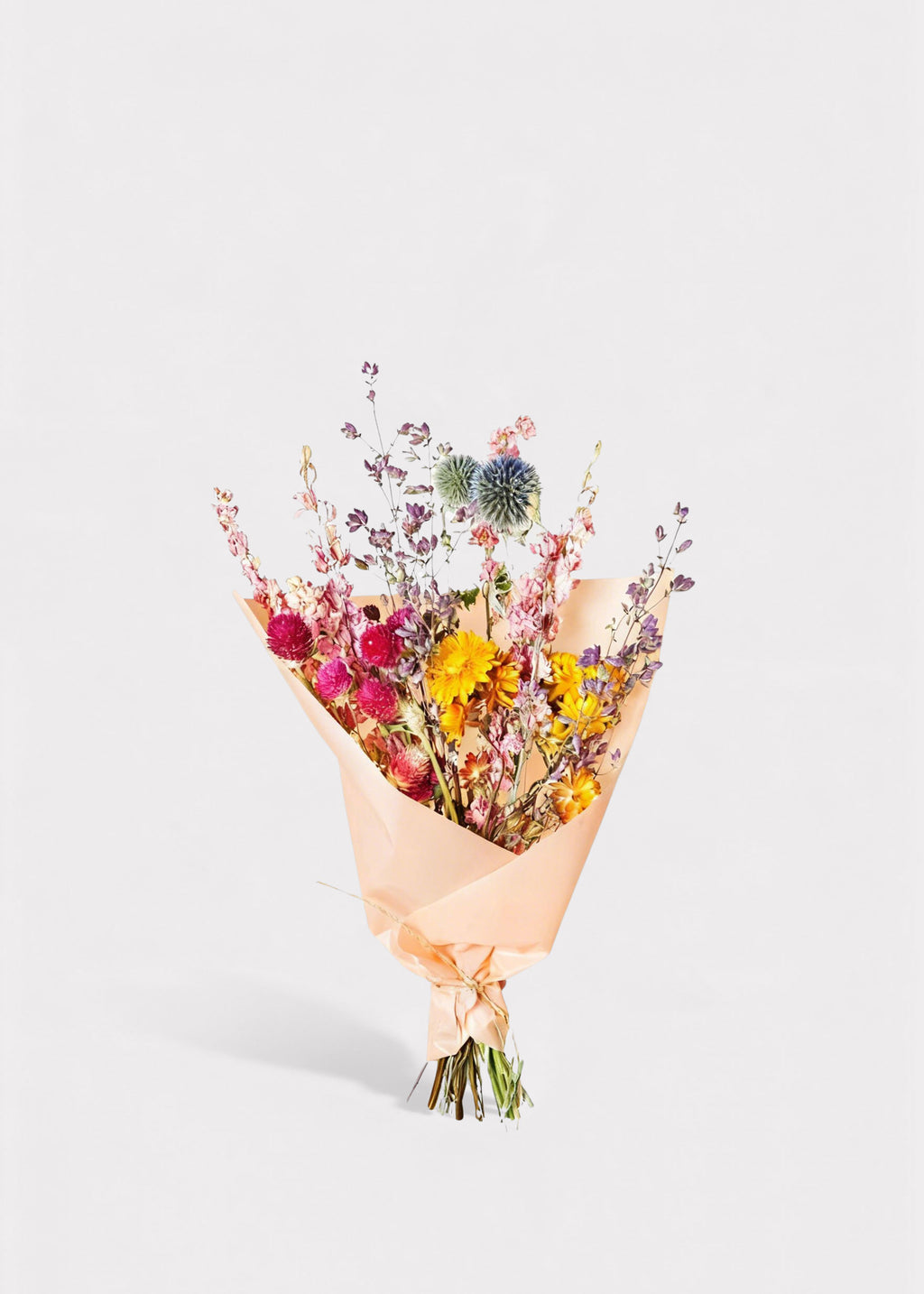 Bouquet of dried flowers wrapped in brown paper 