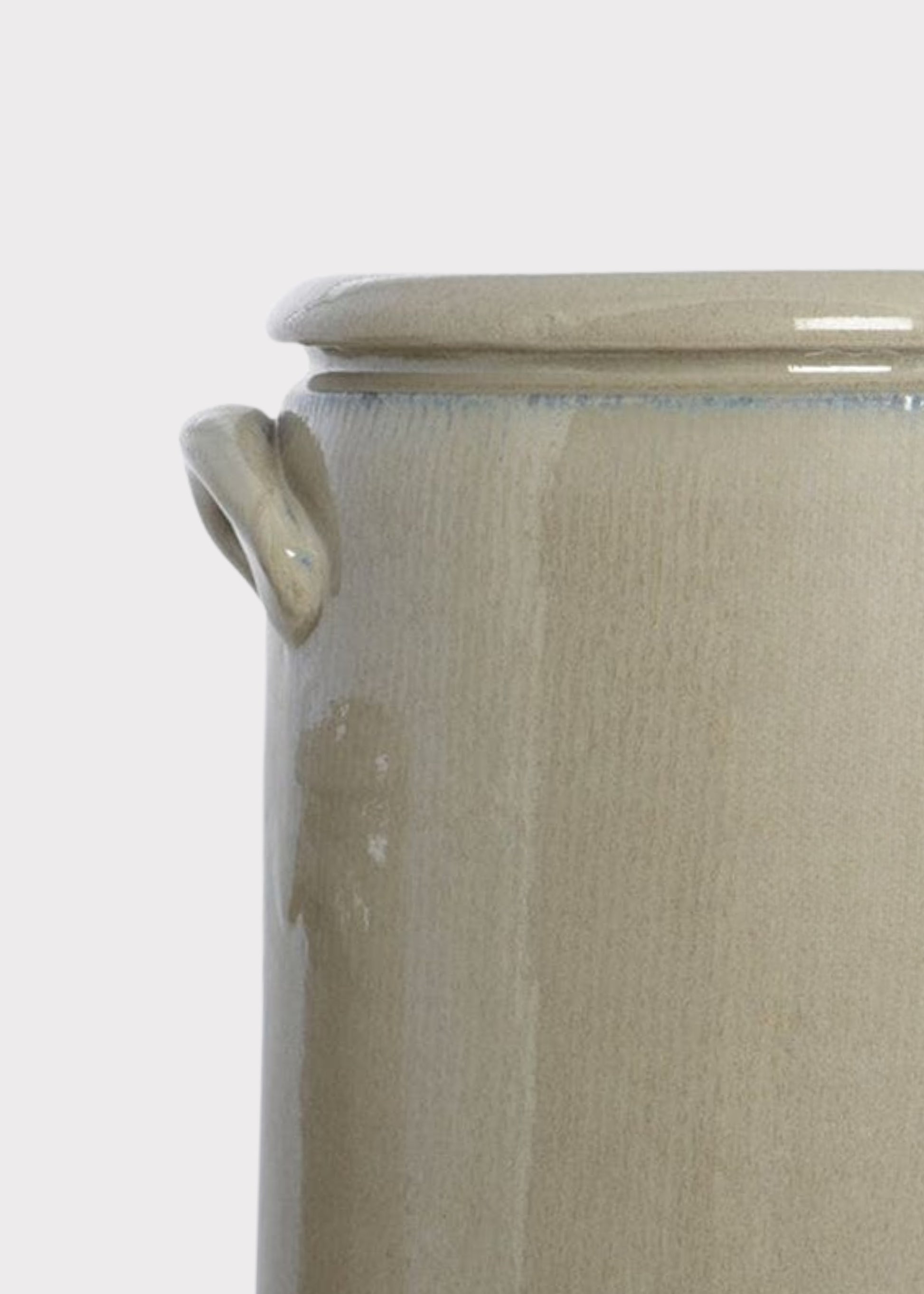 Close-up of a tan crock vase