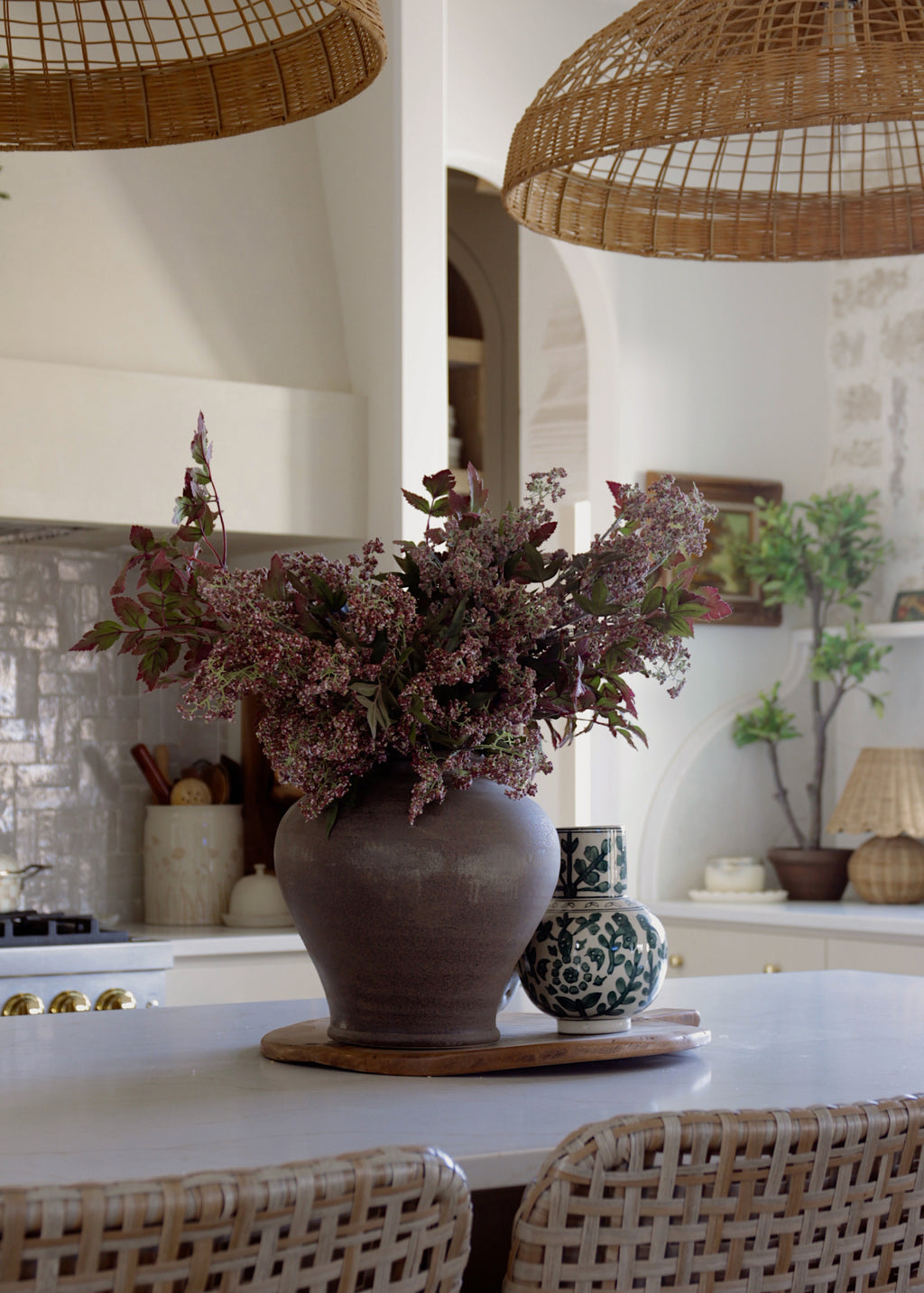 Decorative stoneware vase with plum berries and cimicifuga