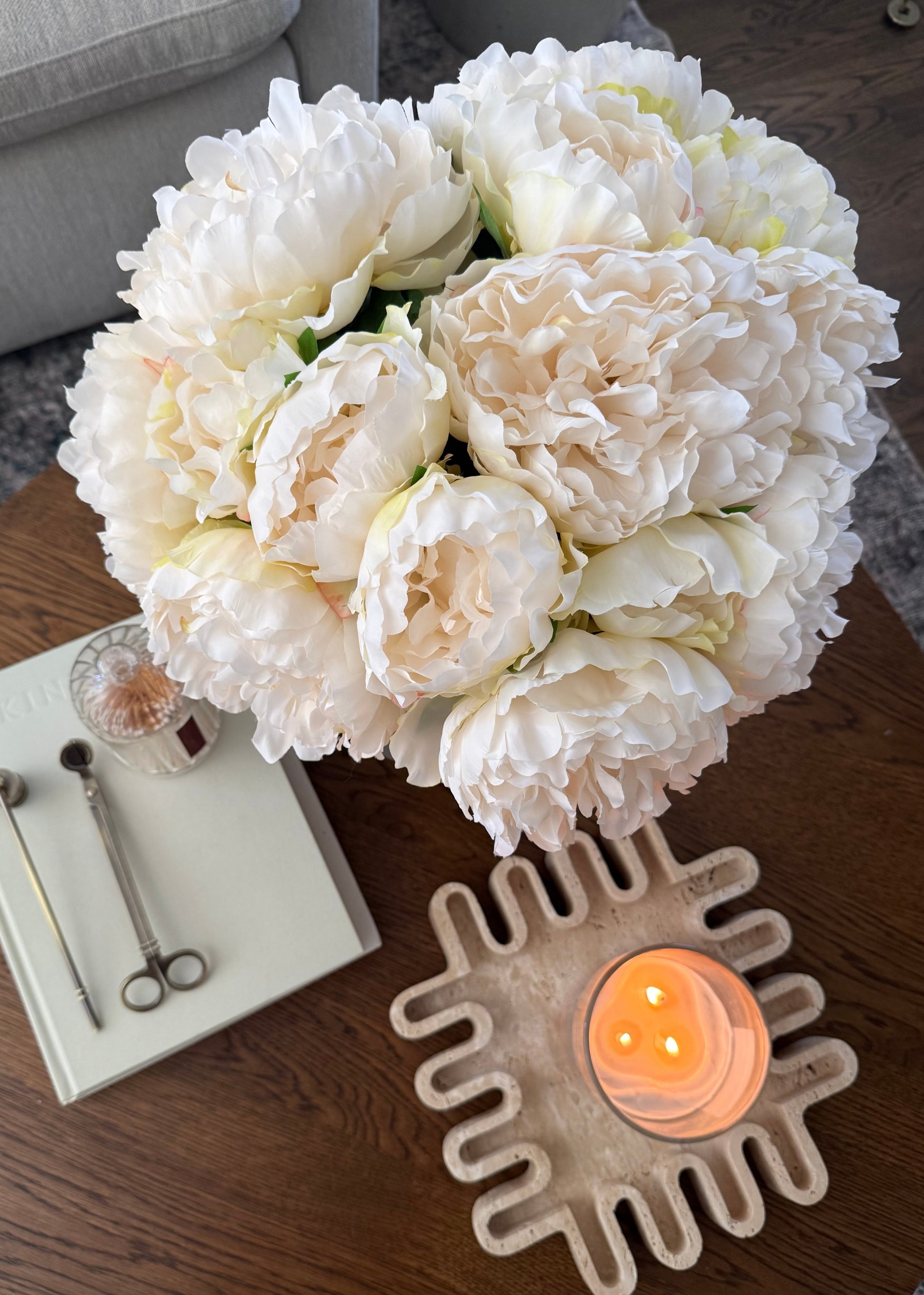 Bouquet of white peony flowers on a coffe table