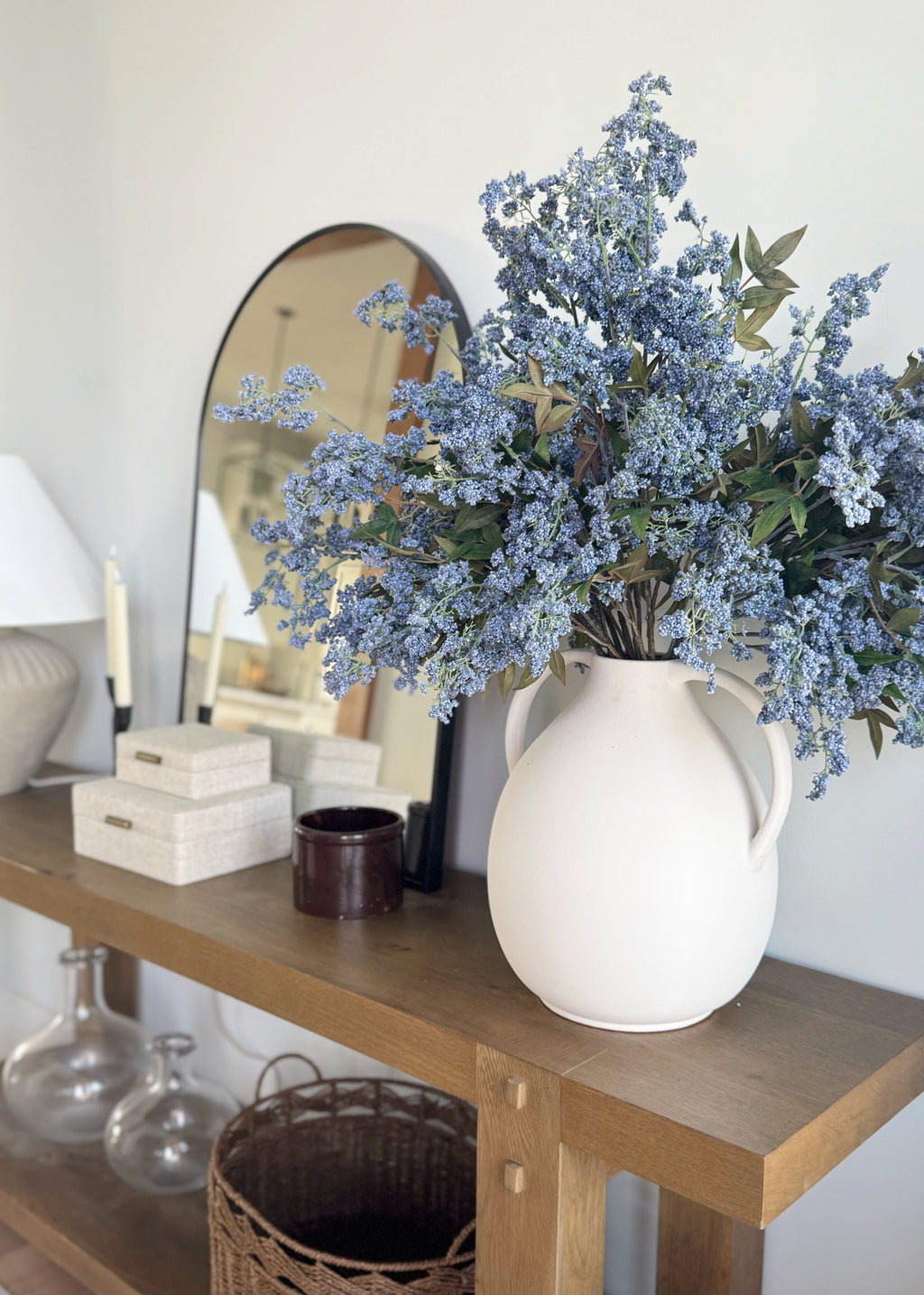 White vase with faux Plum Berry branches in blue